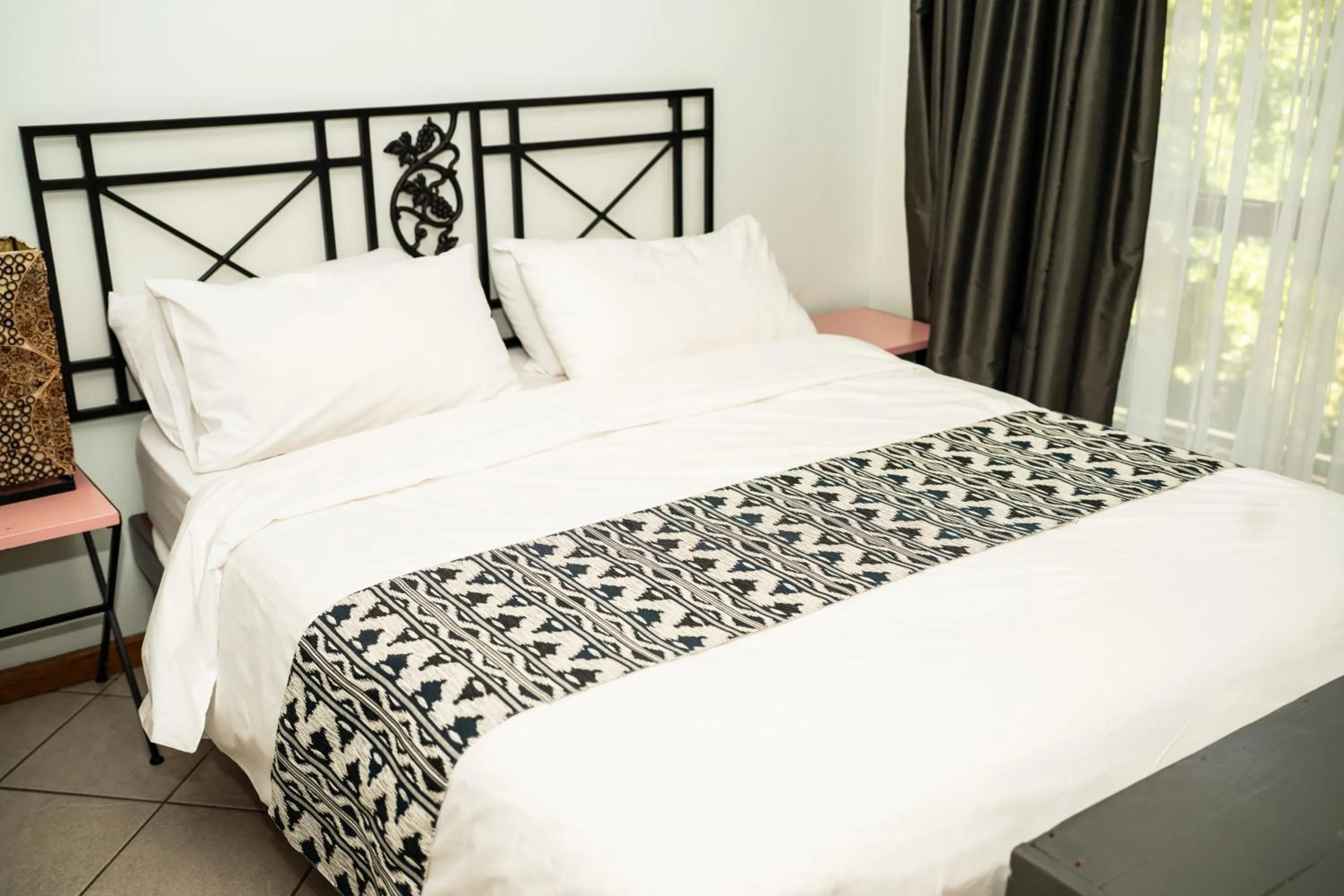 Bed in De Wingerd Wijnland Lodge