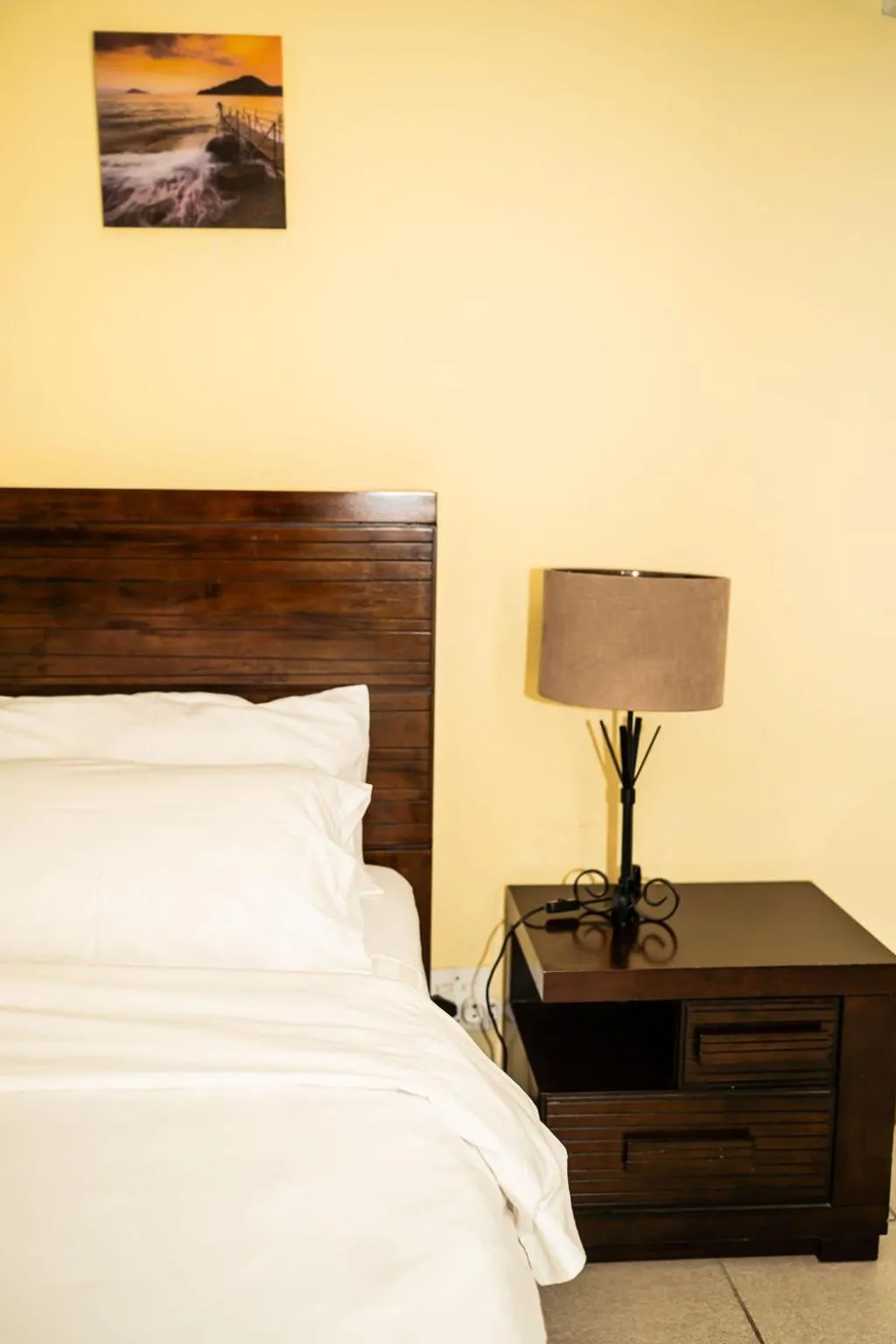 Bed in De Wingerd Wijnland Lodge