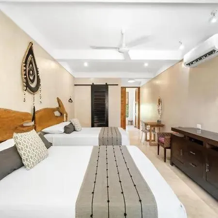 Bed in Holbox Deluxe Apartments