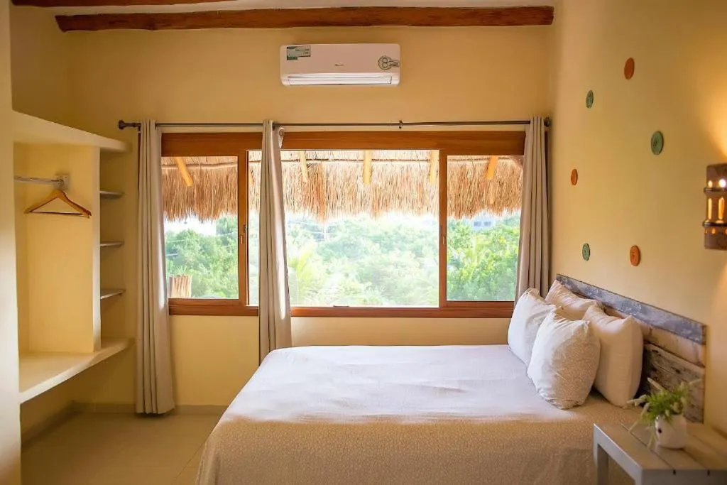 Bed in Holbox Deluxe Apartments