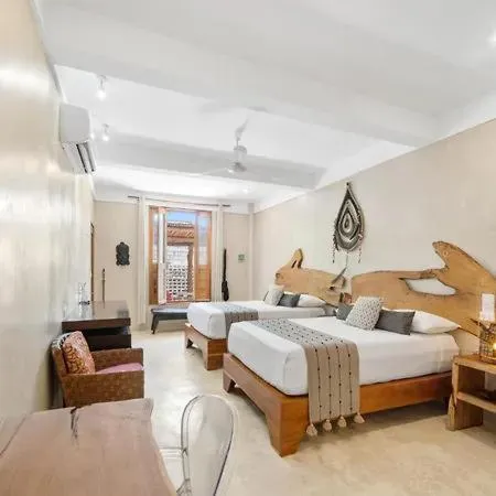 Bed in Holbox Deluxe Apartments