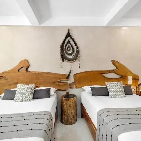 Bed in Holbox Deluxe Apartments