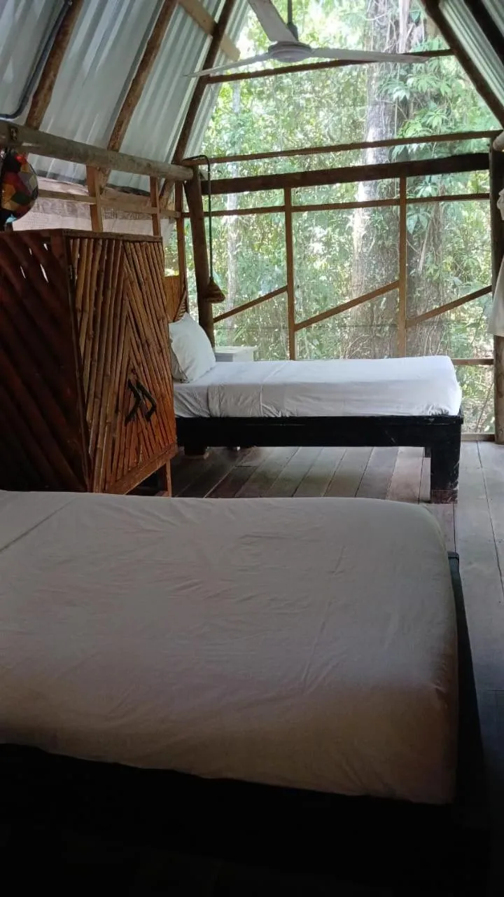 Bed in Tortugal Boutique River Lodge