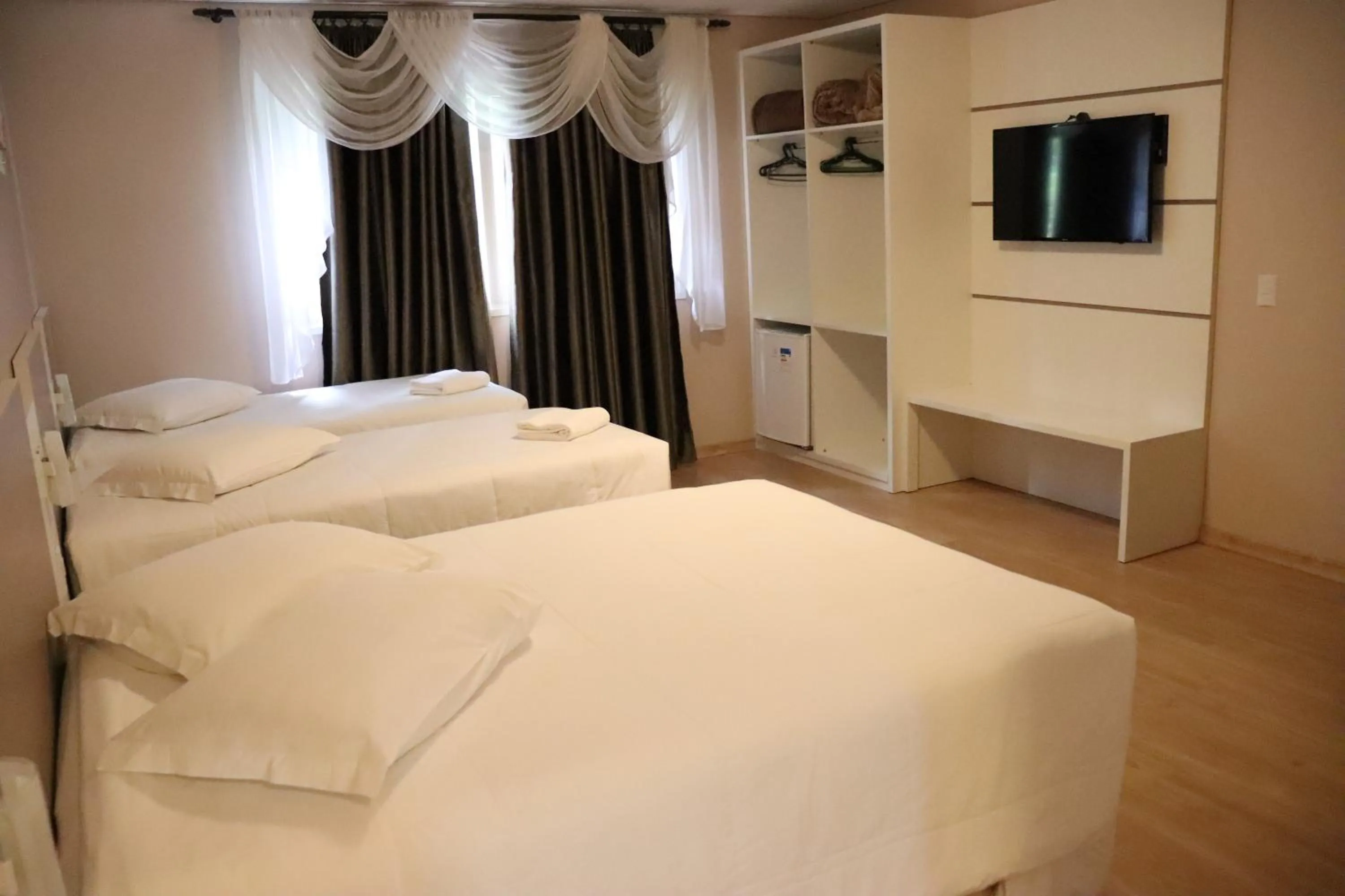 Bed in Pousada Vovô Nino