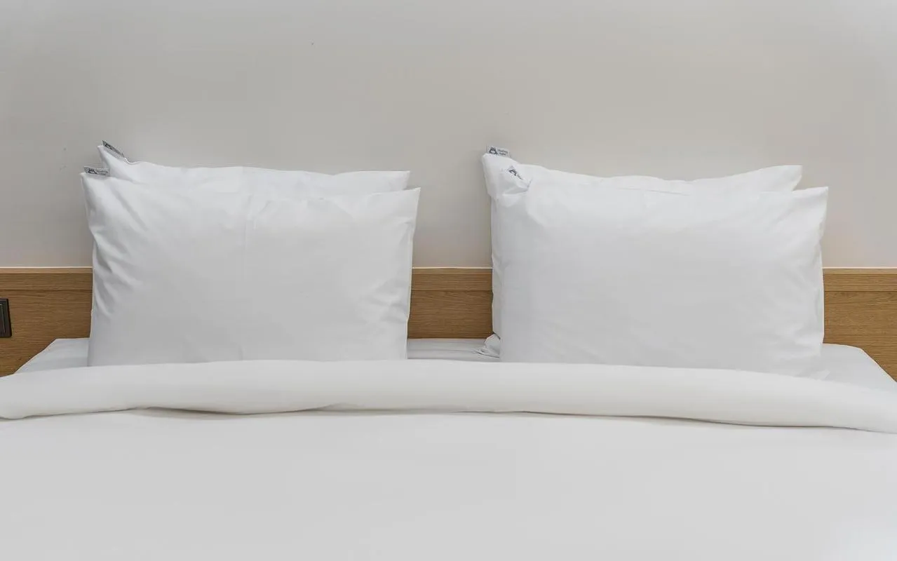 Bed in Bluefrog Hotel