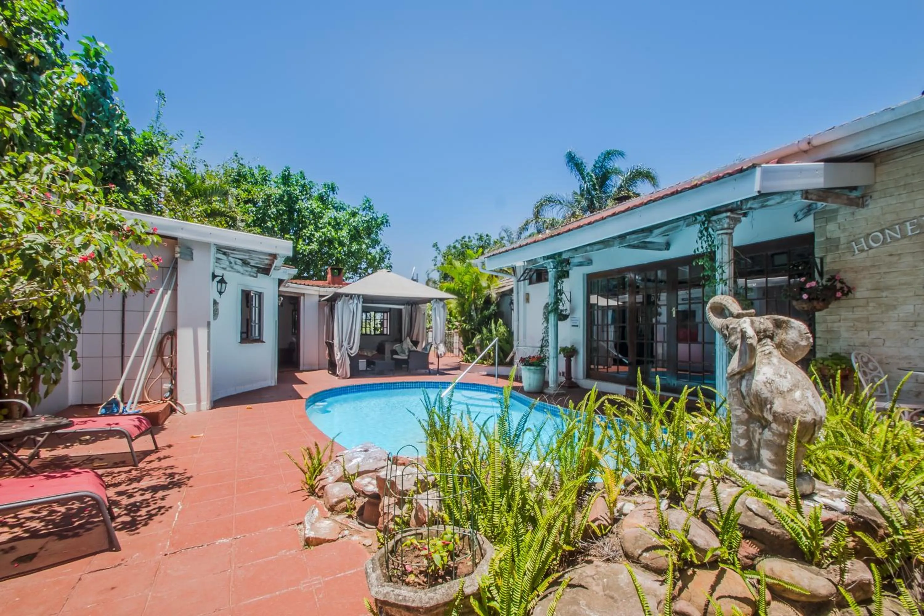 Swimming pool in HoneyPot Guest house