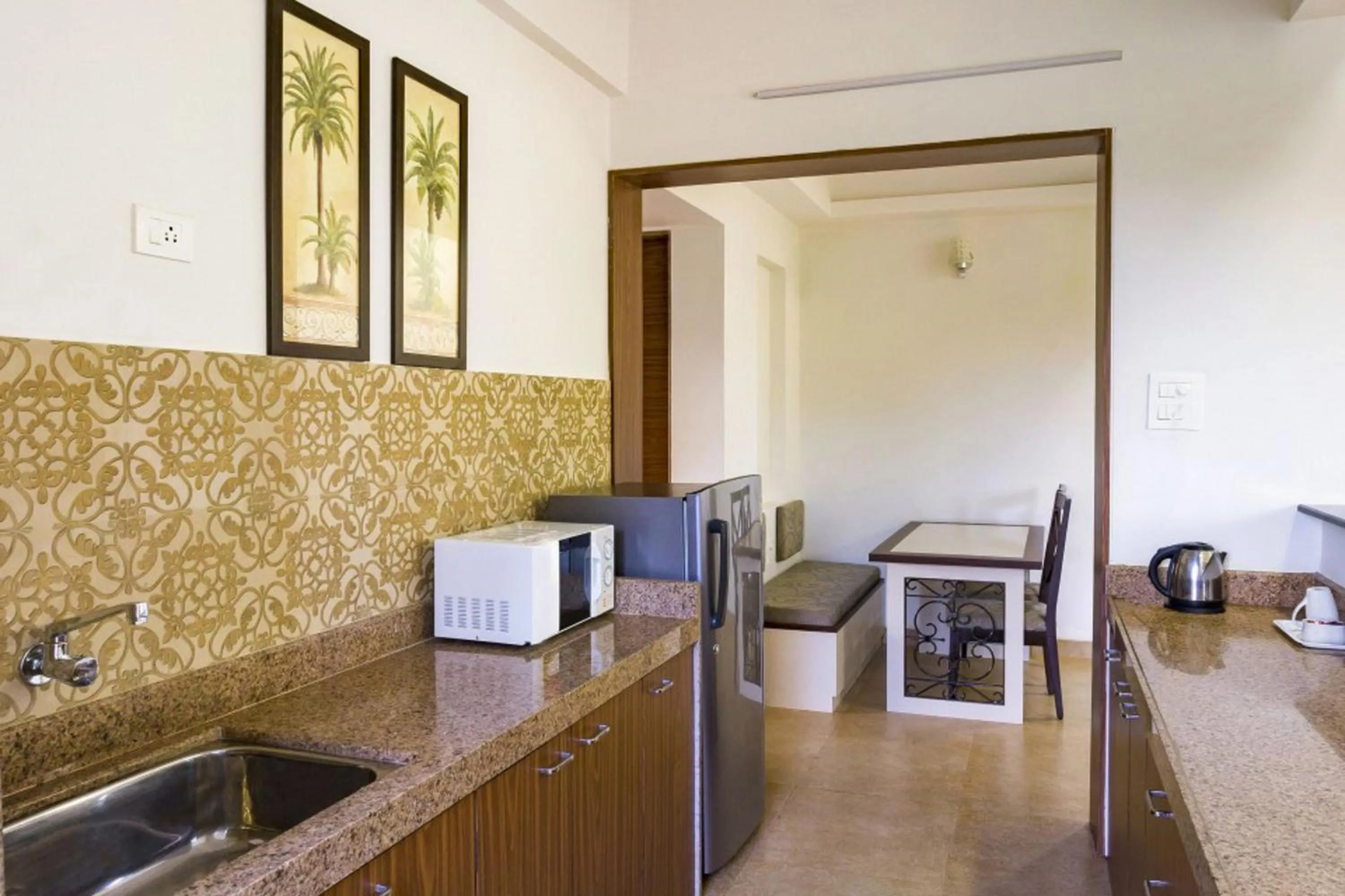 Kitchen or kitchenette in La Vida Studio Inn Baga- Goa- By Lords Hotels and Resorts