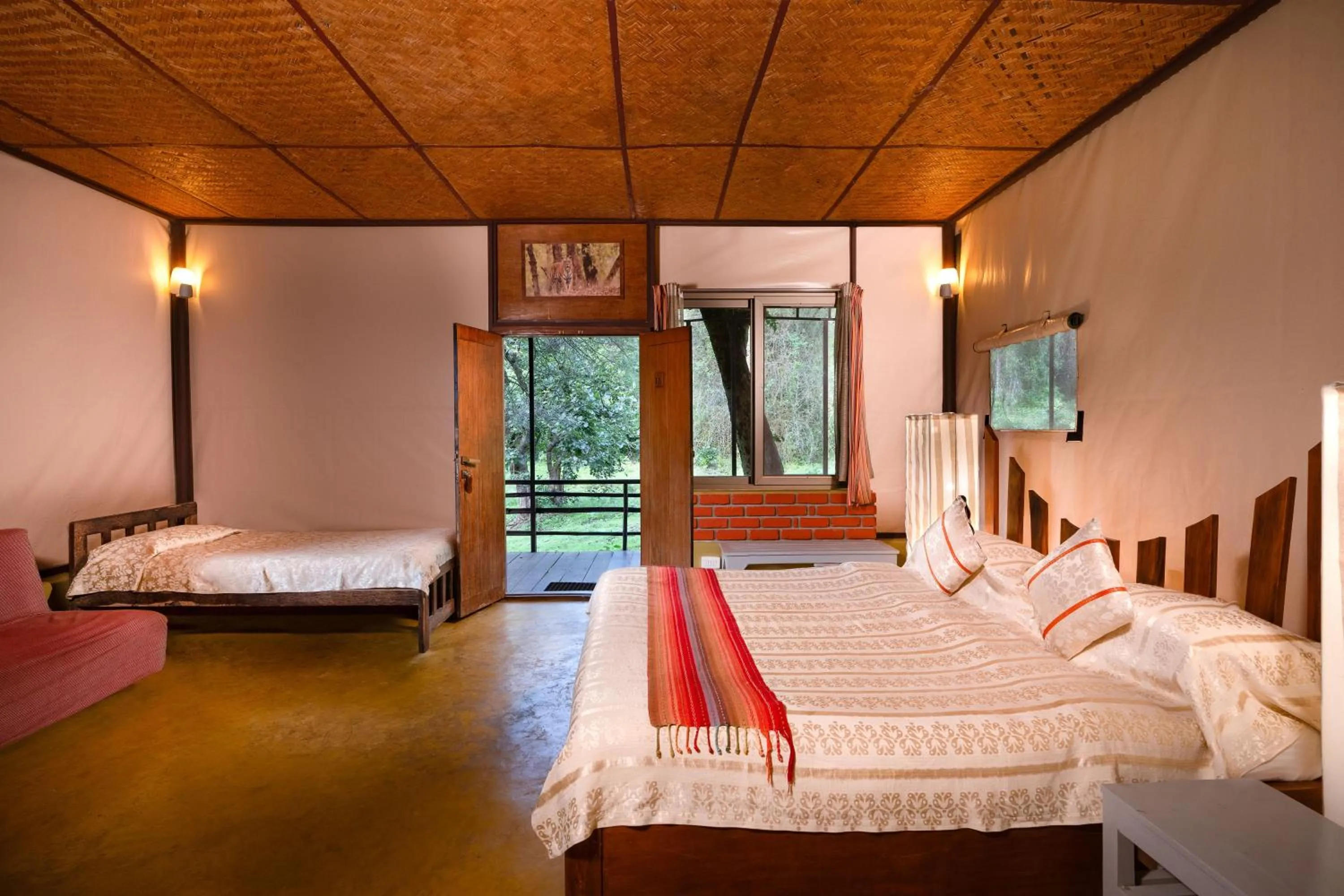Bed in Jungle Hut Resort