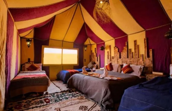 Bed in Merzouga Luxury Camp