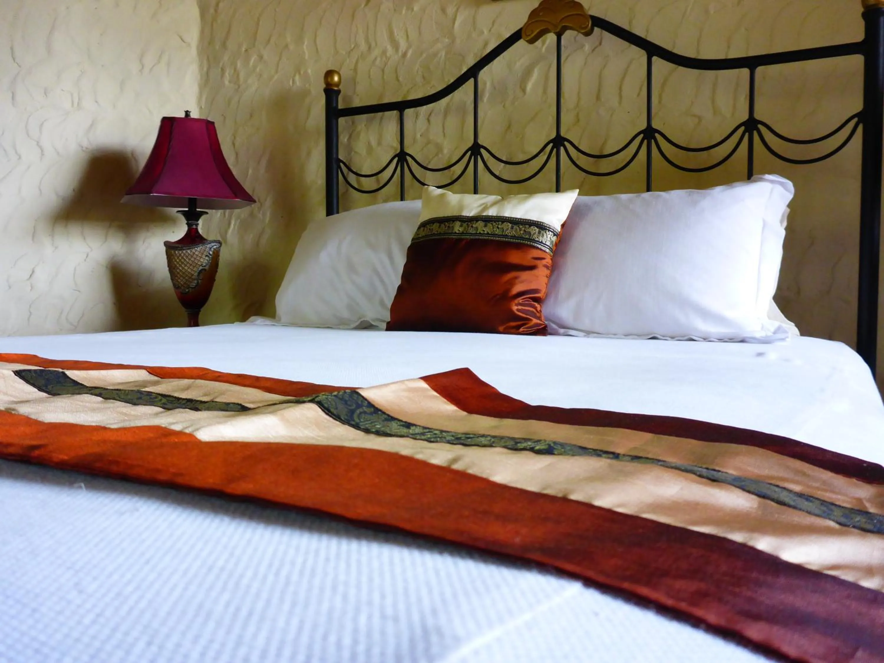 Bed in The Golden Frog Inn