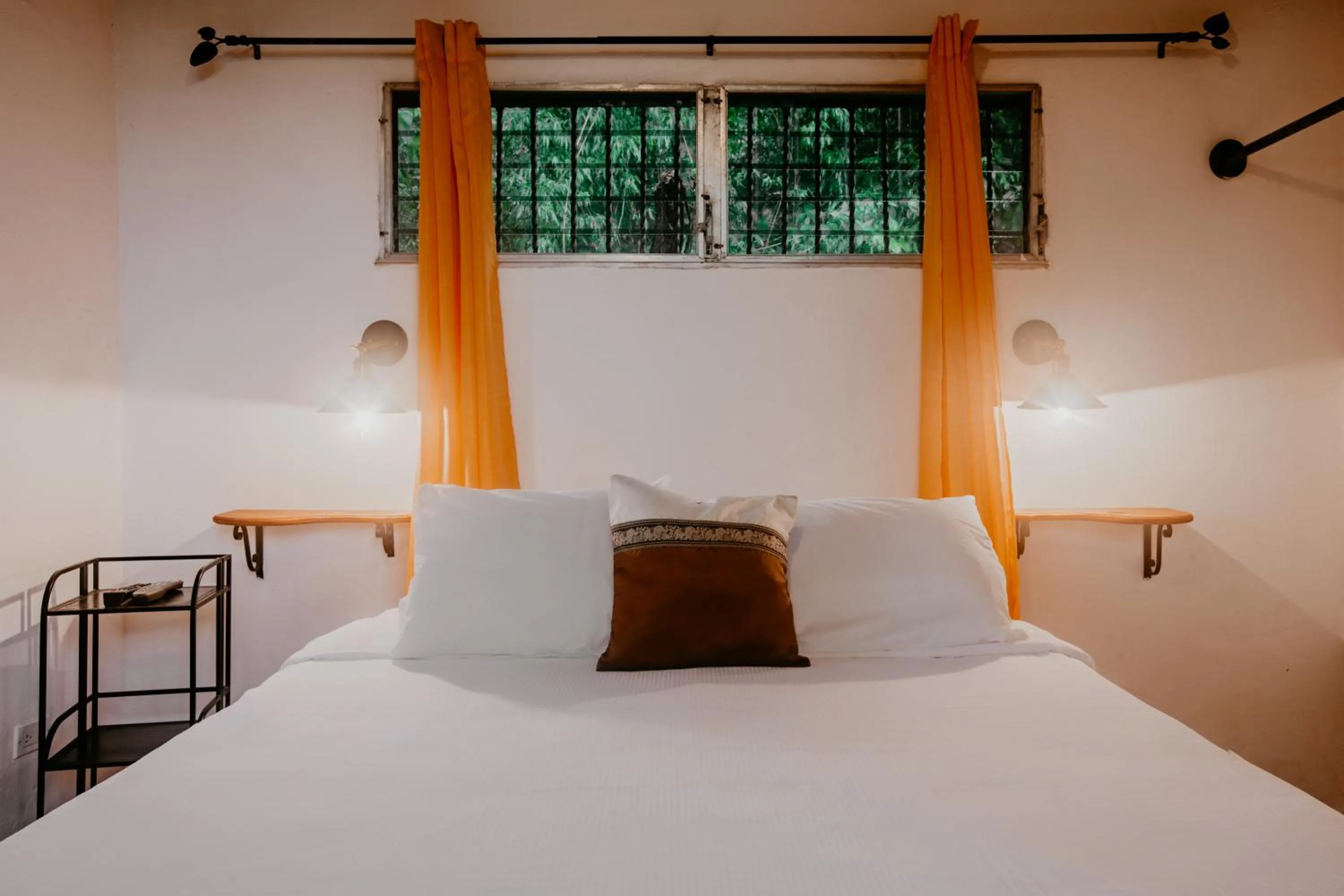 Bed in The Golden Frog Inn