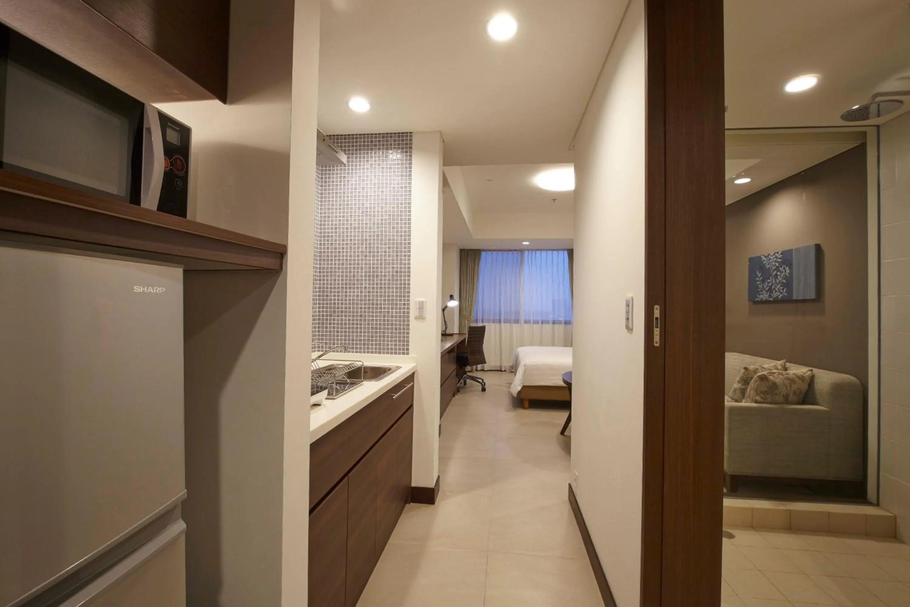 Kitchen or kitchenette, Bed in Axia South Cikarang Service Apartment