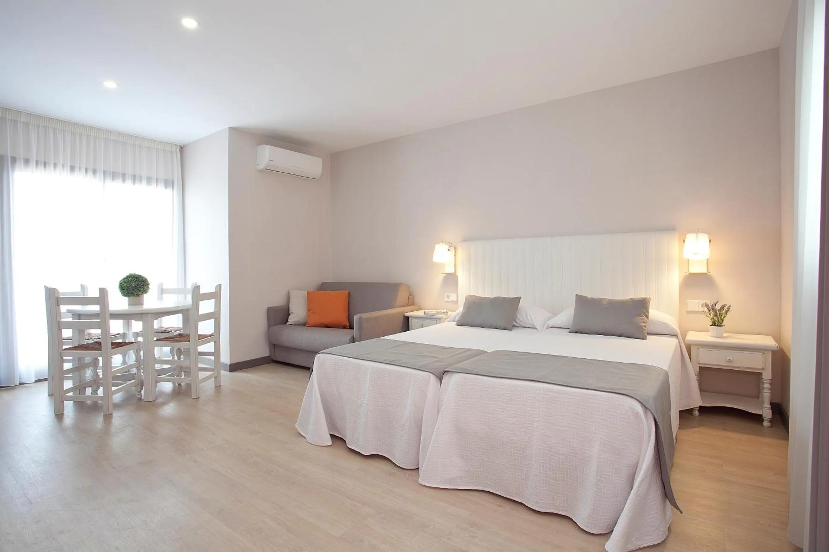 Living room, Bed in Apartamentos Ribera