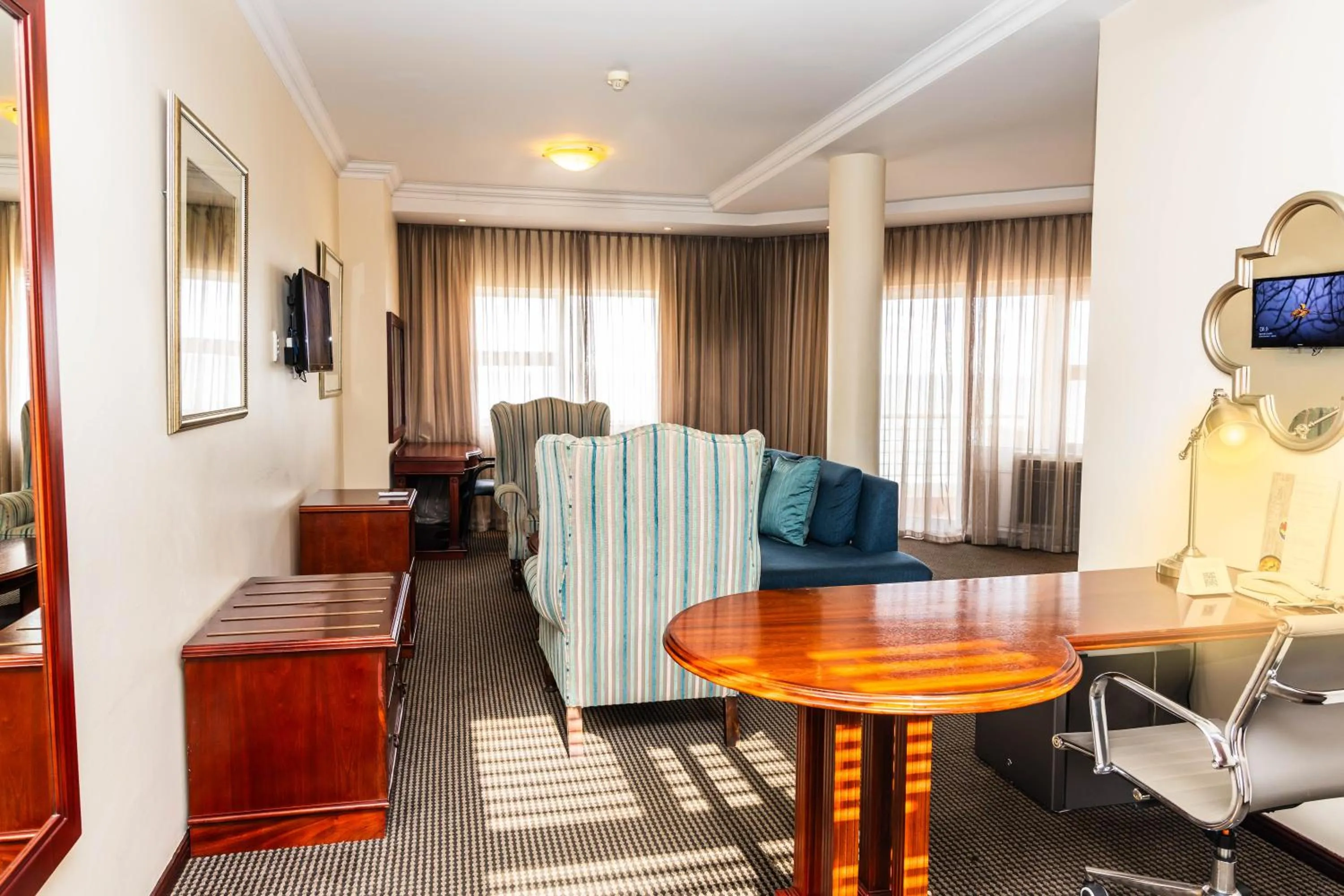 Living room in Premier Hotel Regent