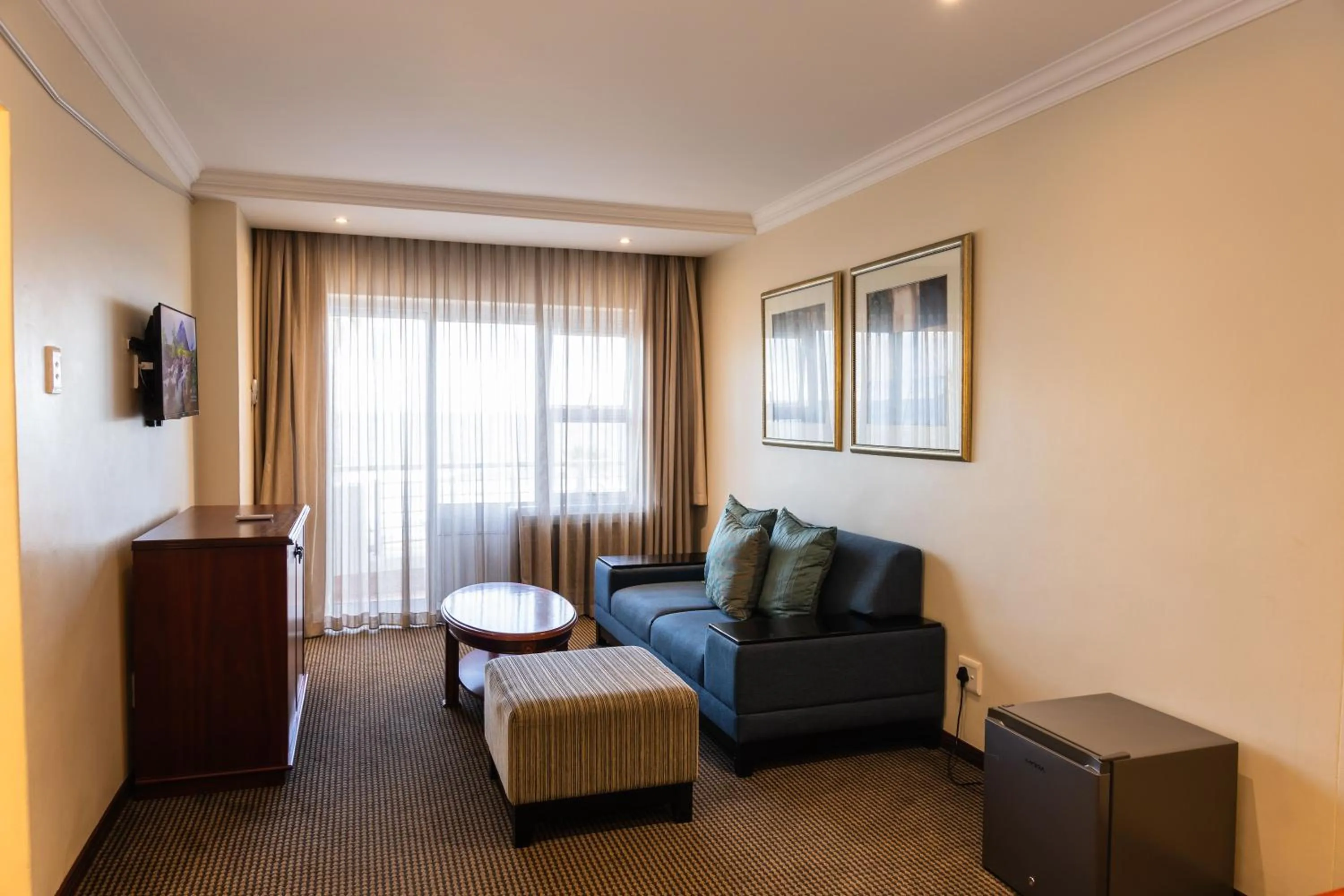 Living room in Premier Hotel Regent