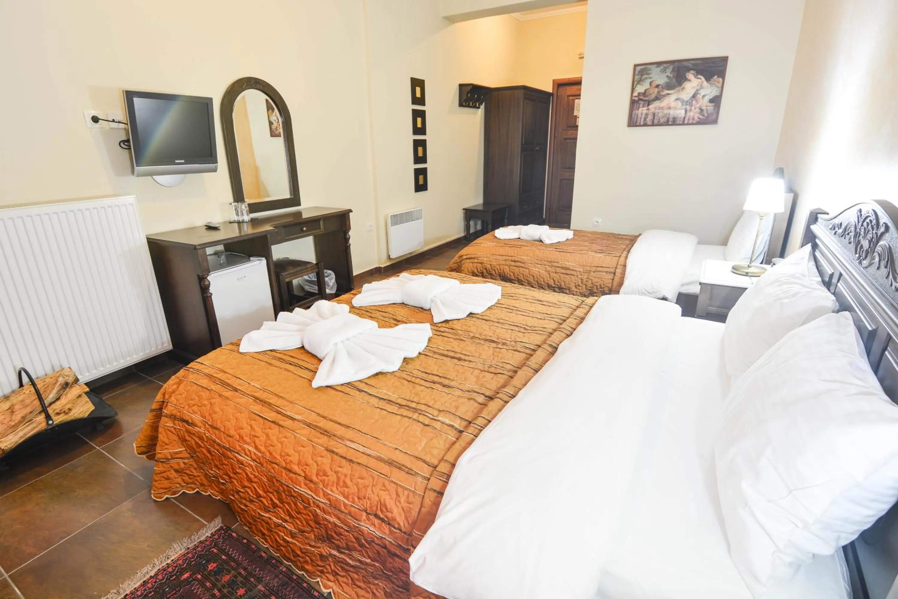 Bed in Hotel Iliovasilema