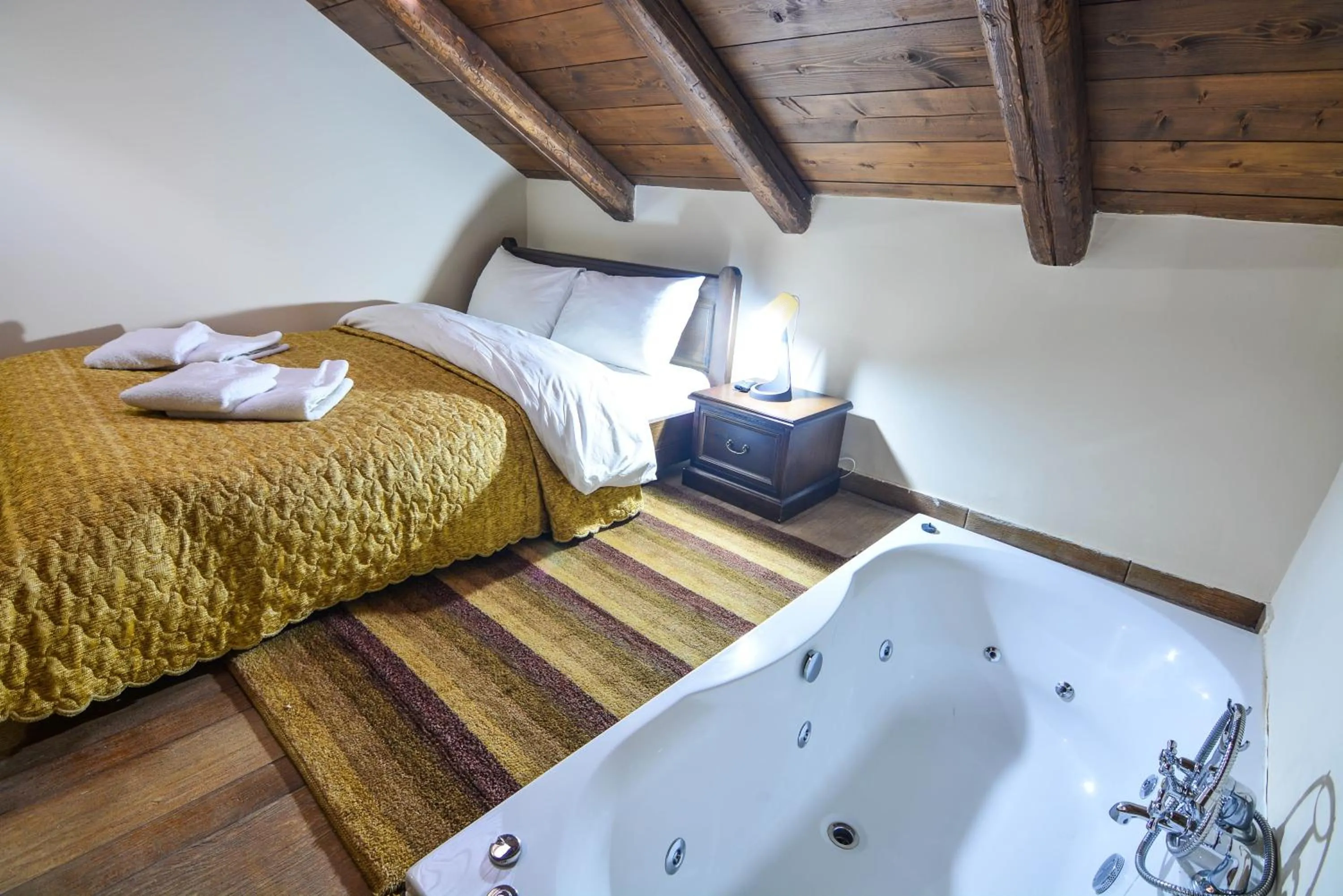 Bed in Hotel Iliovasilema