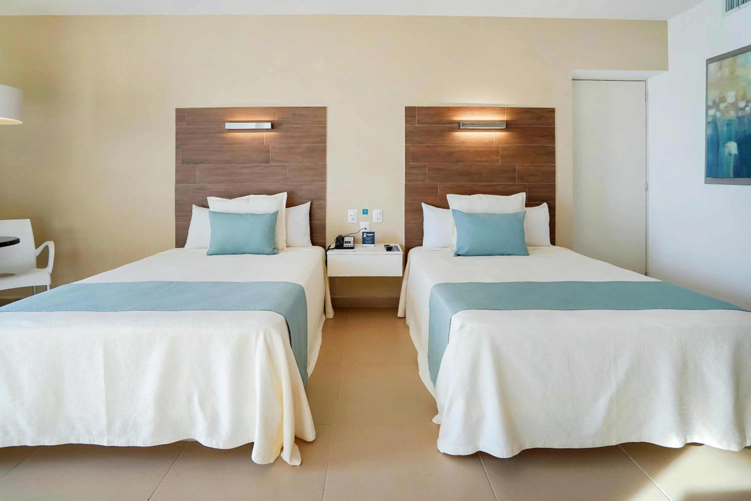 Bed in Pacific Palace Beach Tower Hotel