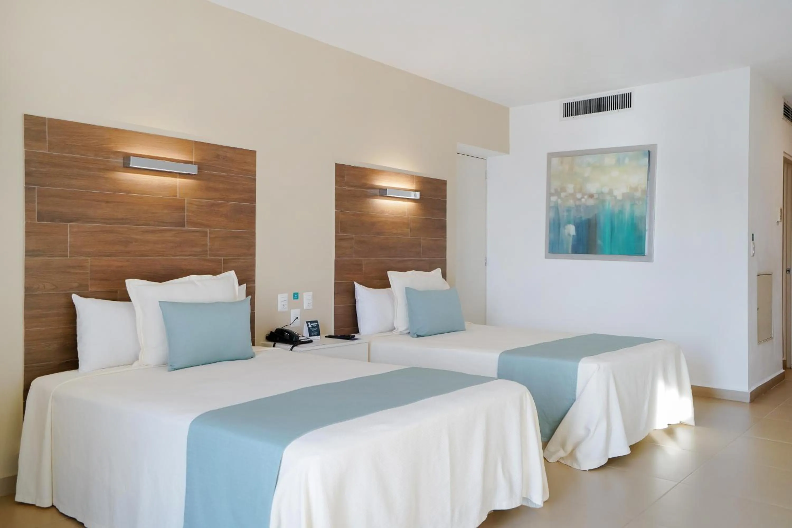 Bed in Pacific Palace Beach Tower Hotel