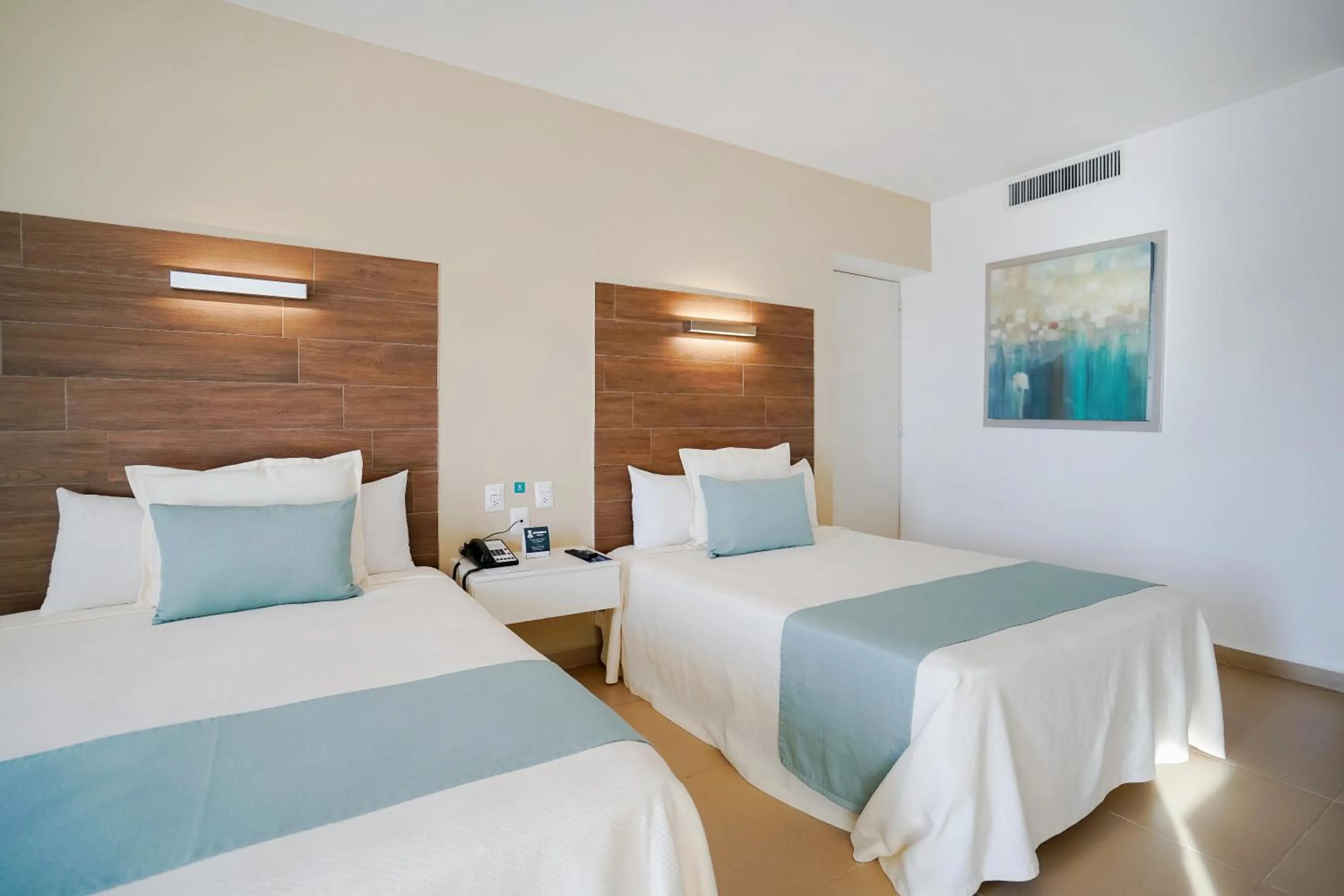 Bed in Pacific Palace Beach Tower Hotel