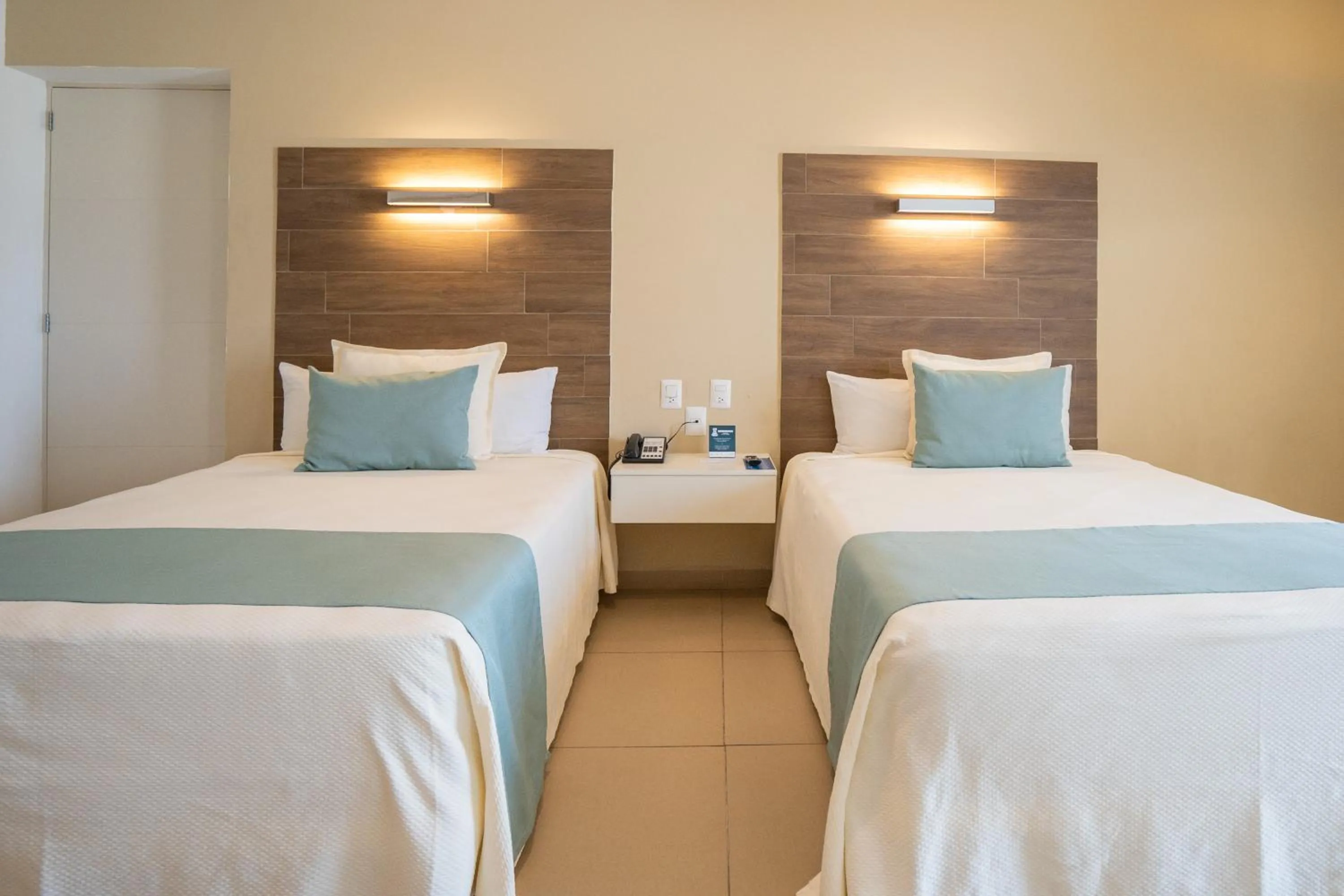 Bed in Pacific Palace Beach Tower Hotel