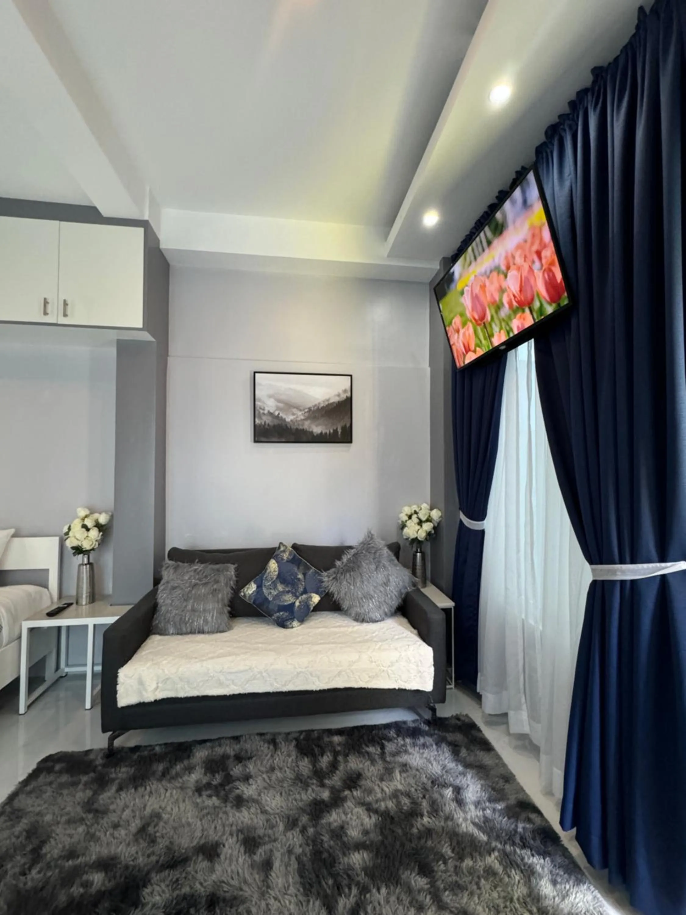 TV and multimedia, Bed in Anavada Suites - Davao City