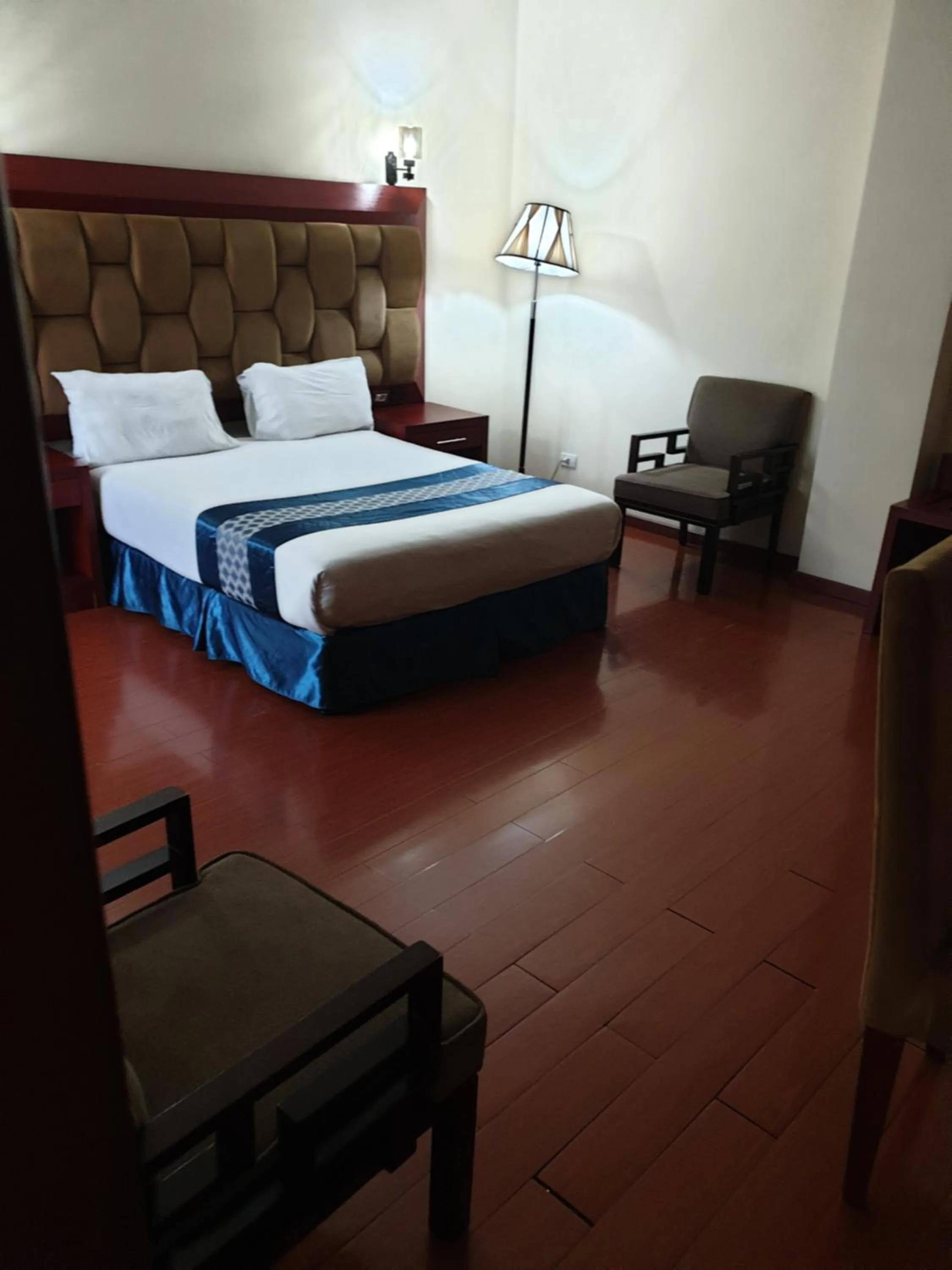 Bed in Blue Birds International Hotel