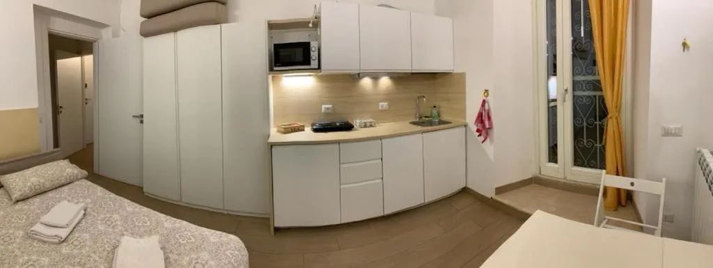 Kitchen or kitchenette, Bed in La Casetta di Ely