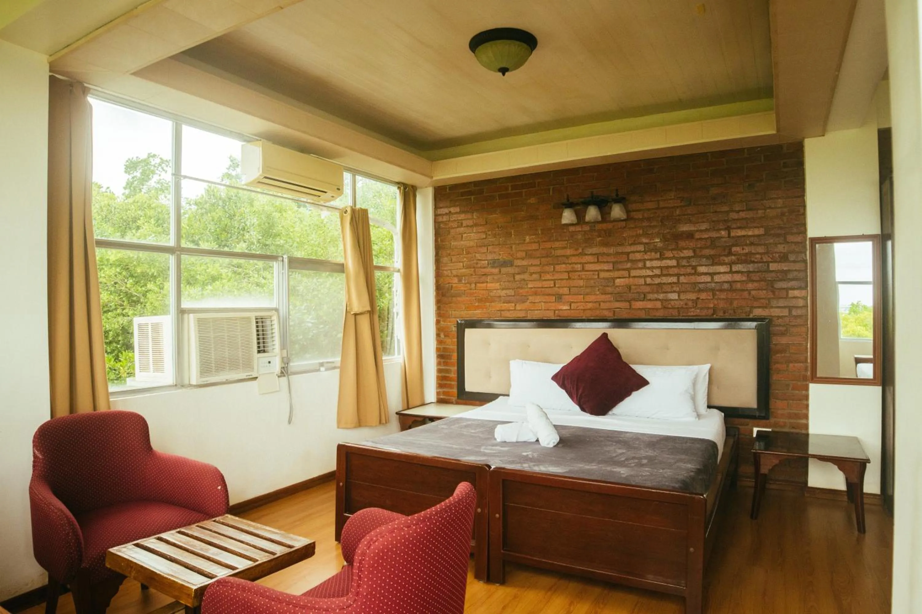 Bed in Marina Palawan Boutique Nature Resort