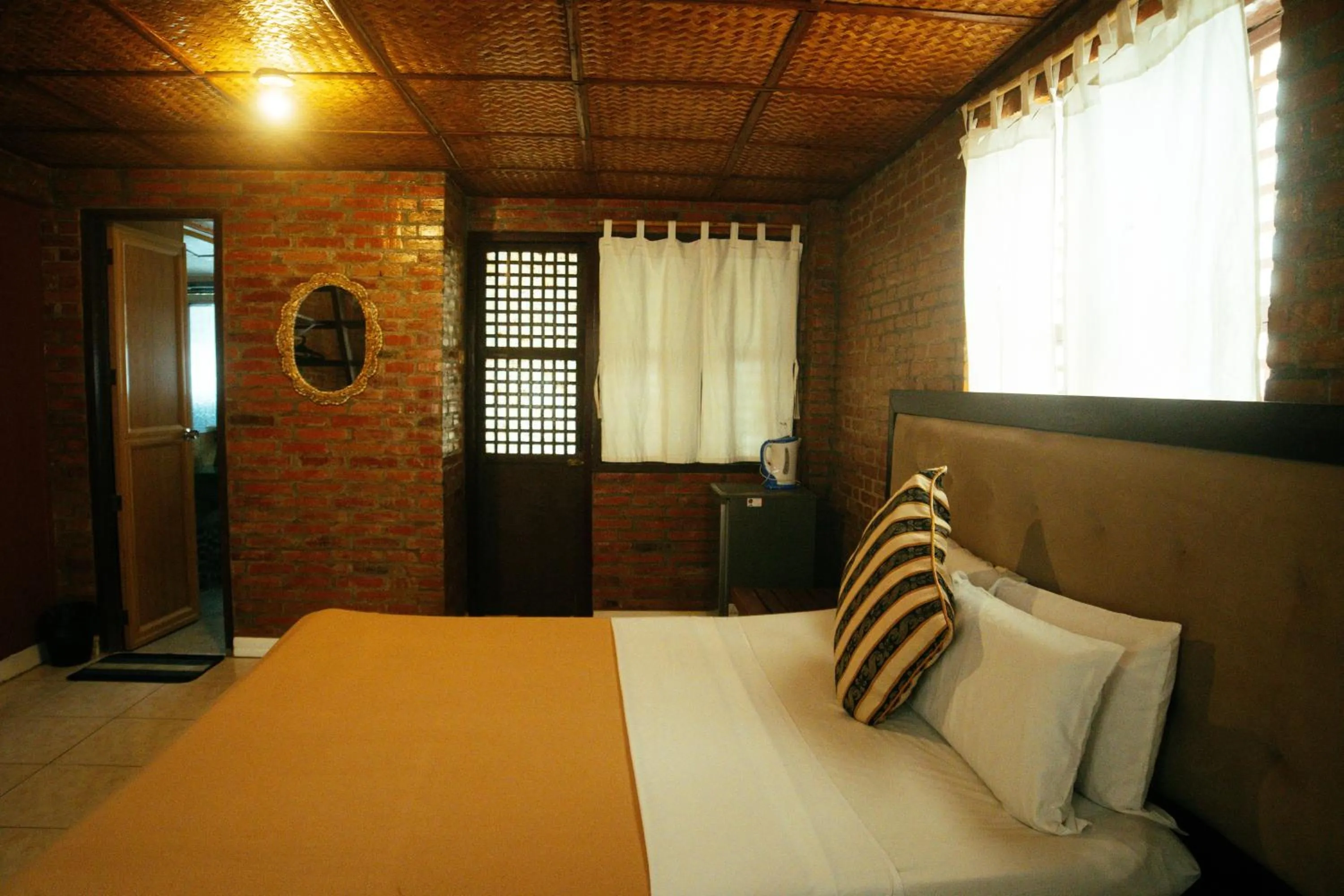 Bed in Marina Palawan Boutique Nature Resort