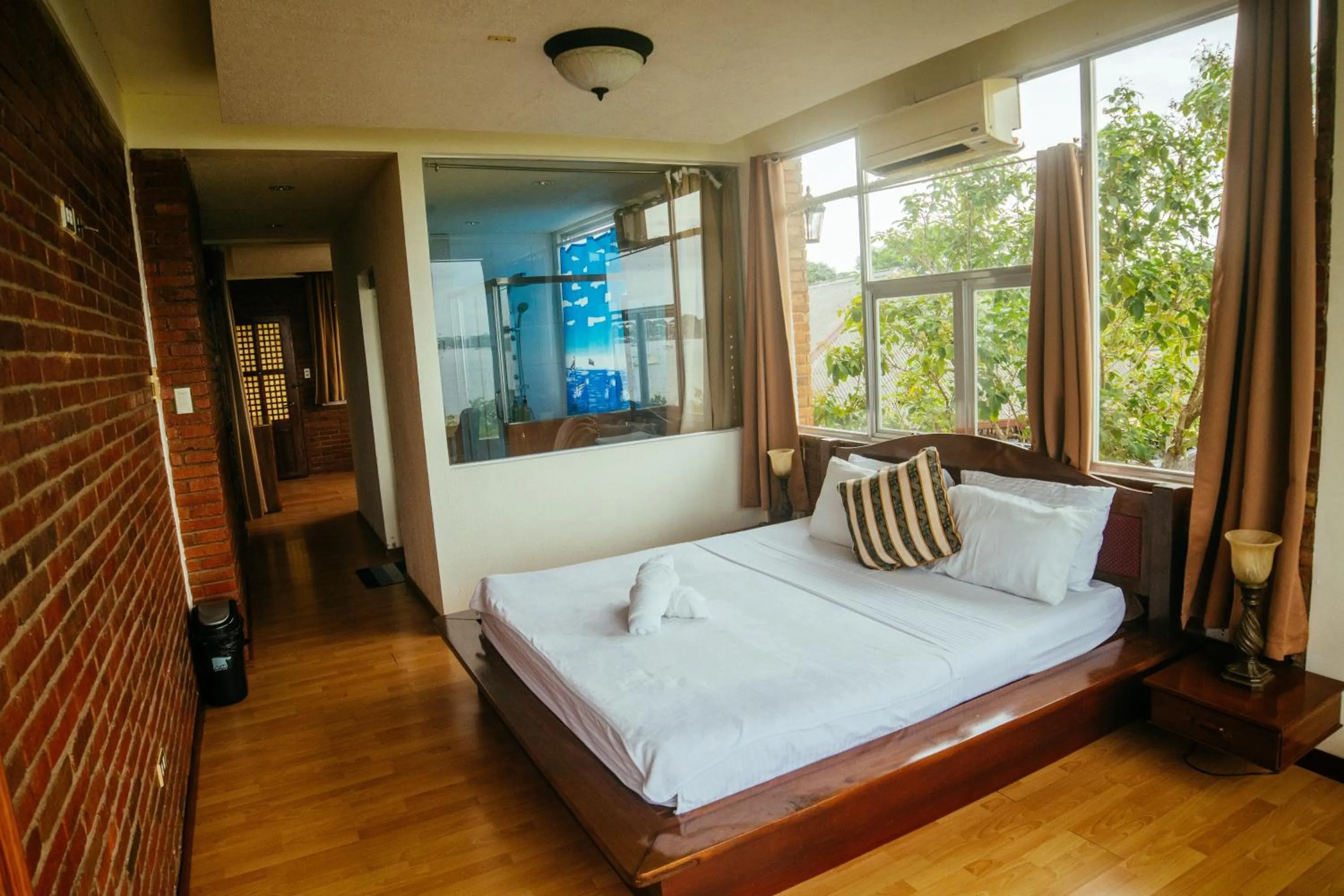 Bed in Marina Palawan Boutique Nature Resort