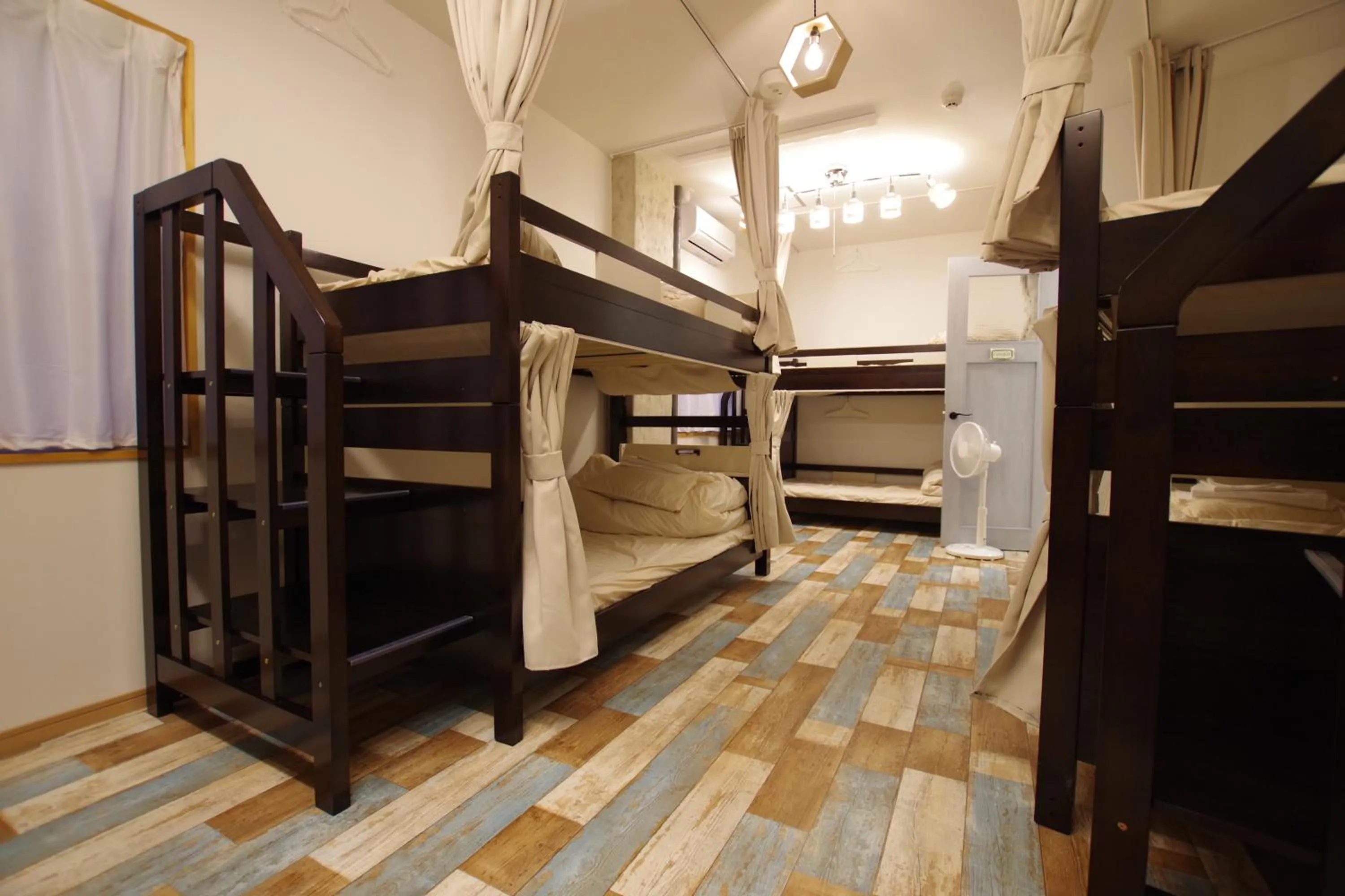 Bed in Cinnamon Guesthouse Dogo