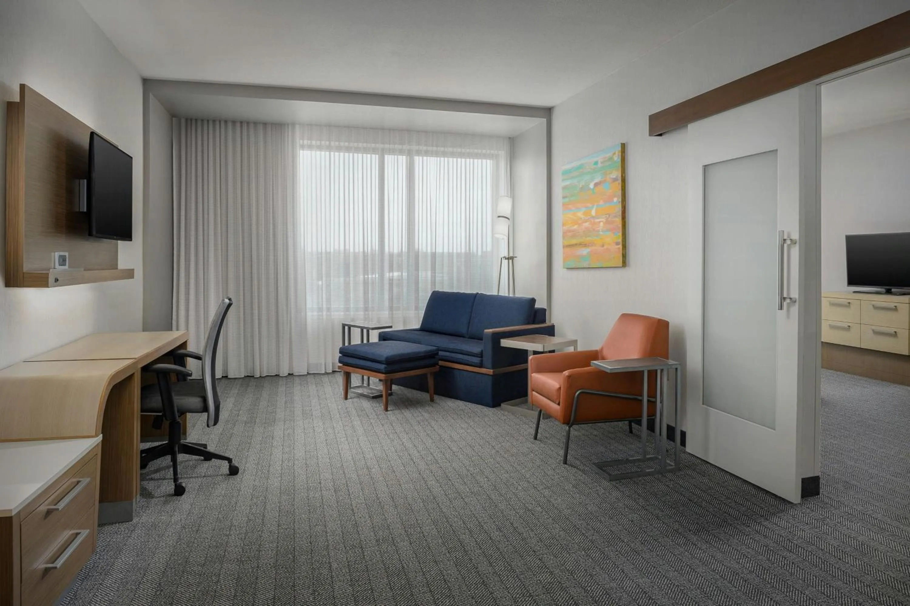 Living room in Courtyard by Marriott Muncie at Horizon Convention Center