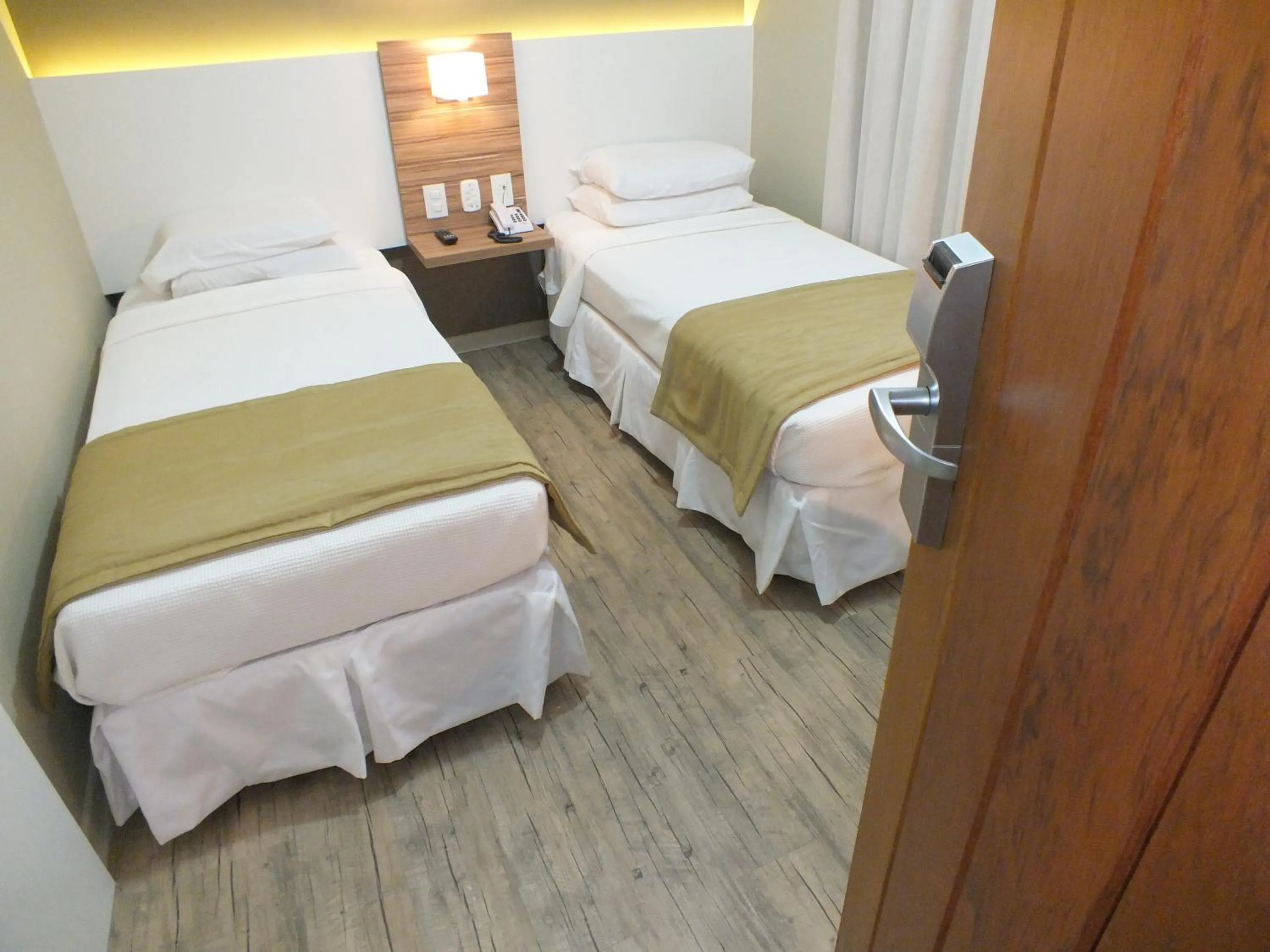 Bed in JB Palace Hotel