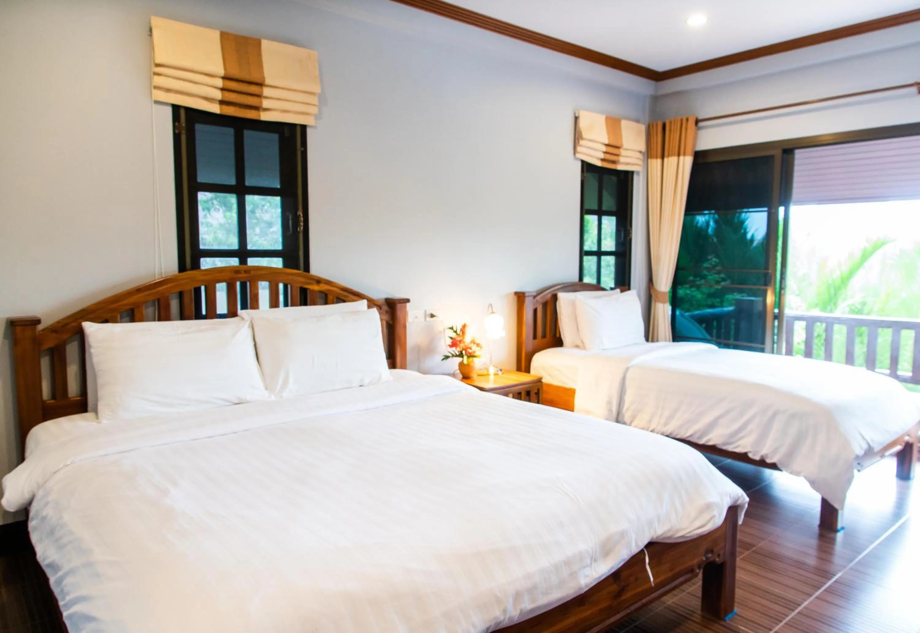 Bed in BaanRimNam Resort Trat