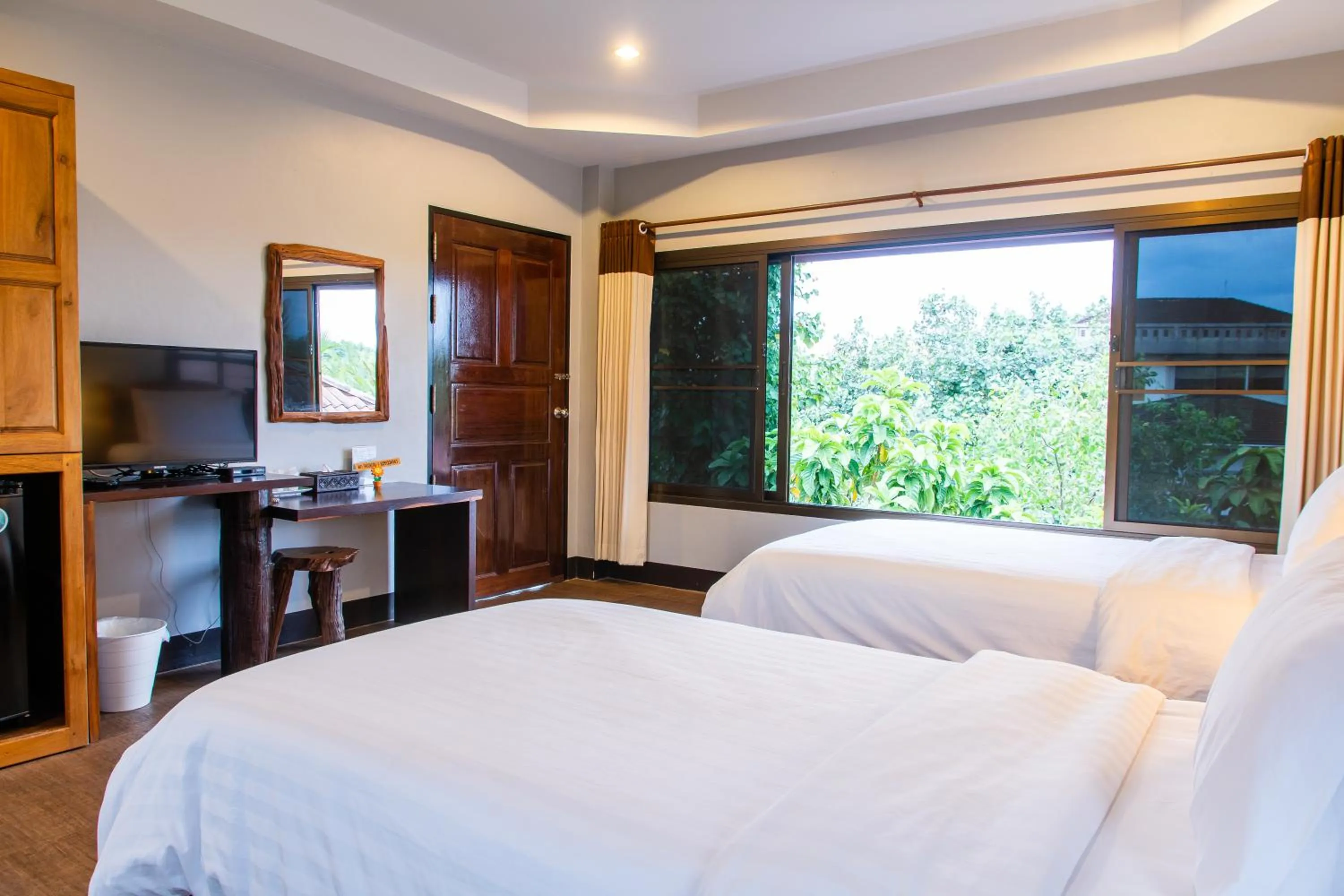 Bed in BaanRimNam Resort Trat