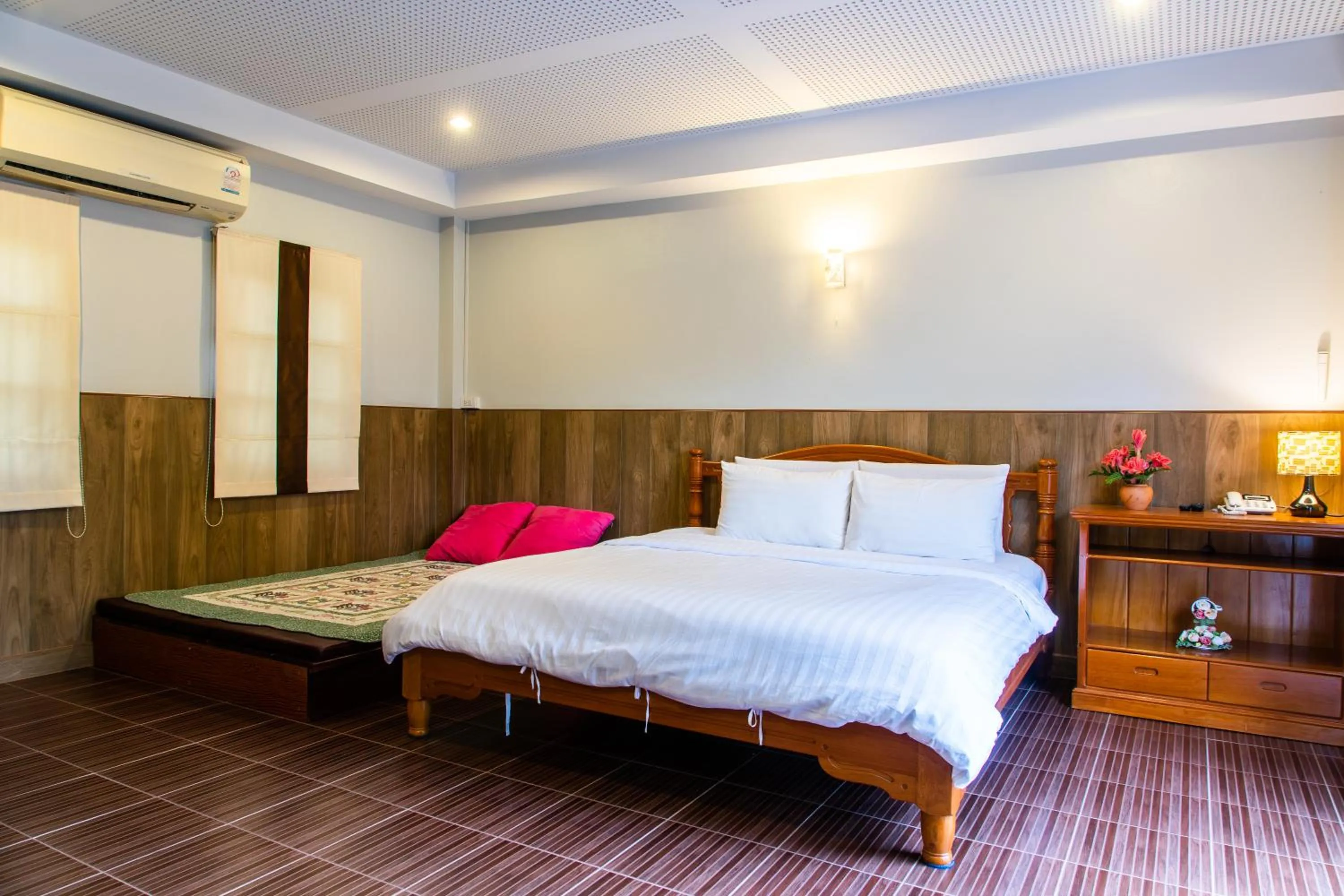 Bed in BaanRimNam Resort Trat