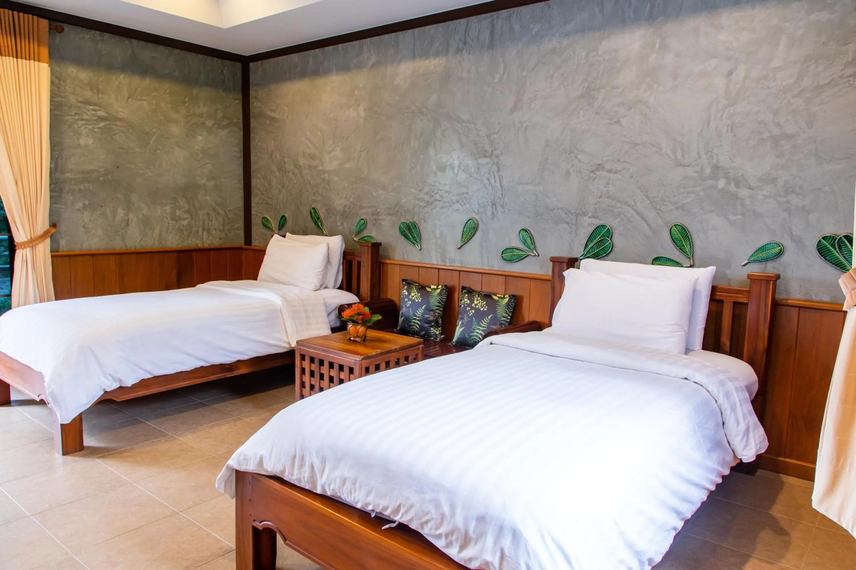 Bed in BaanRimNam Resort Trat