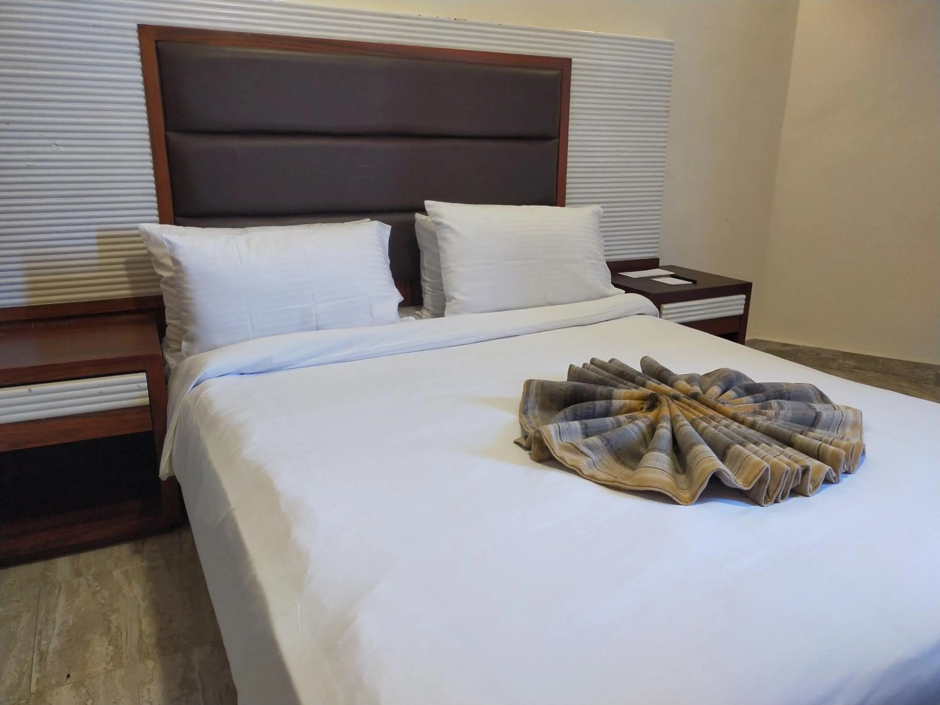 Bed in 26th of July Apartments