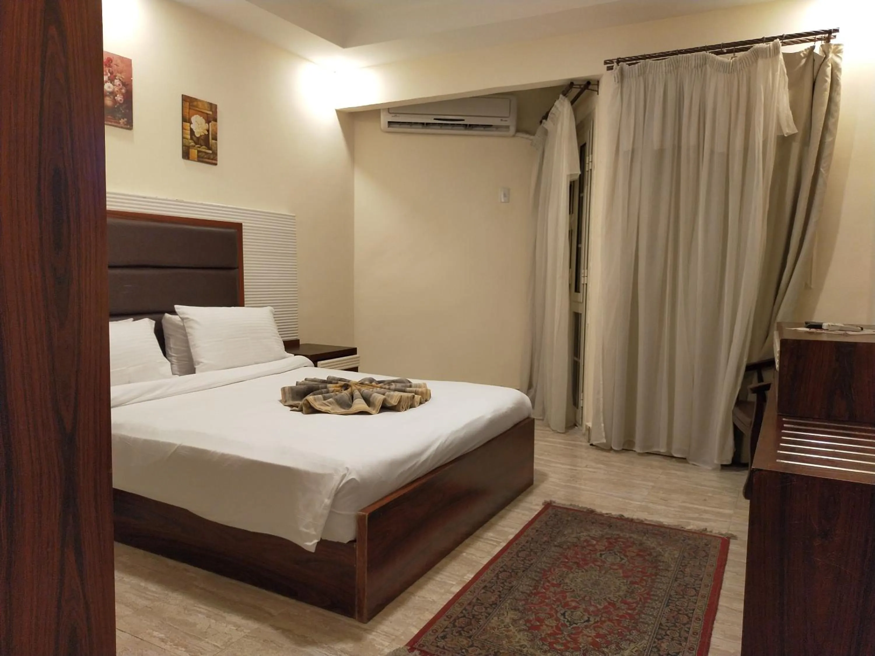 Bed in 26th of July Apartments