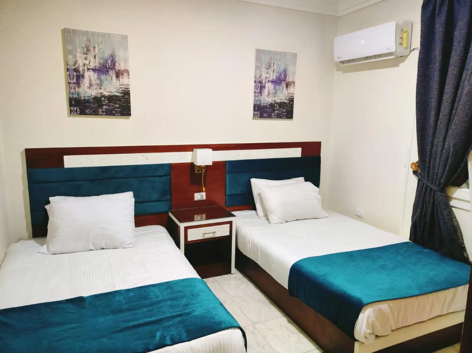 Bed in Asafra Hotel Apartments