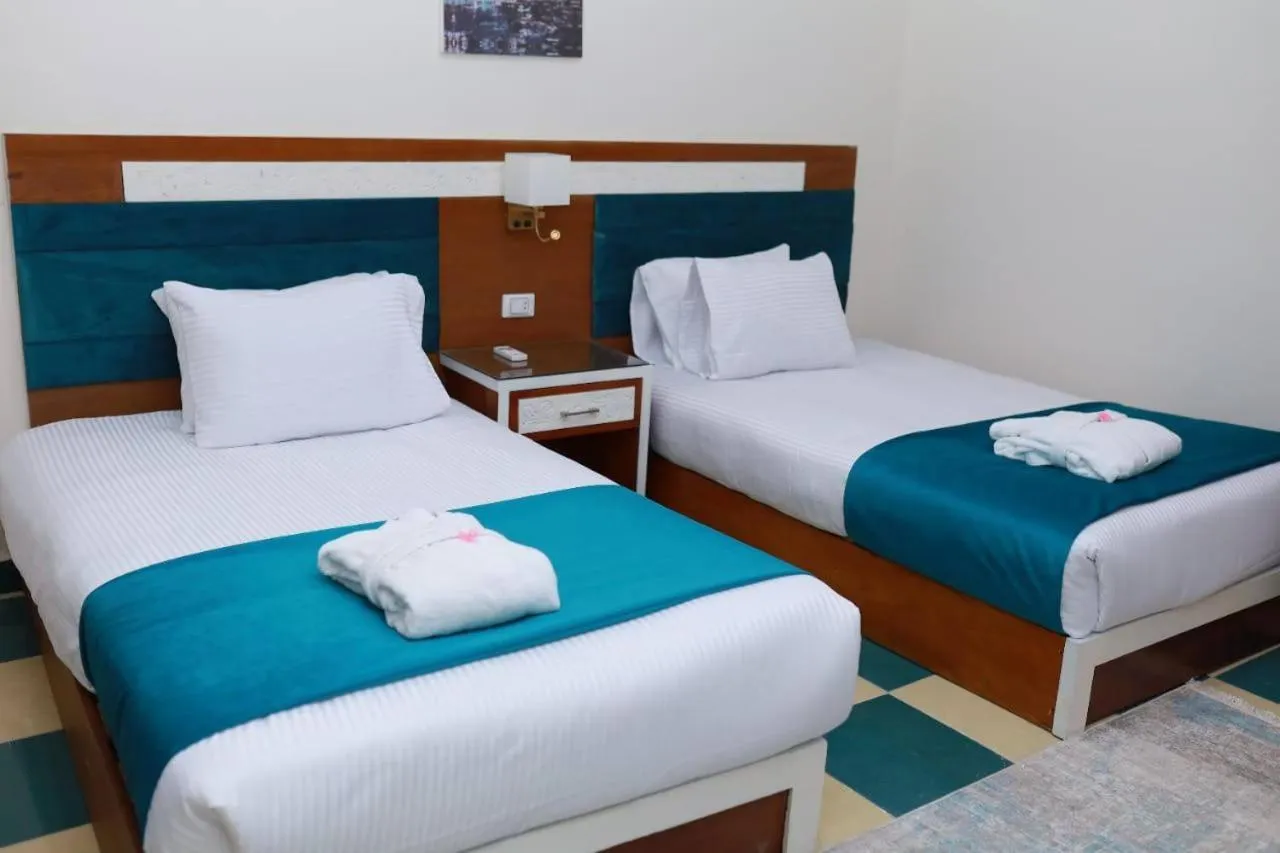 Bed in Asafra Hotel Apartments