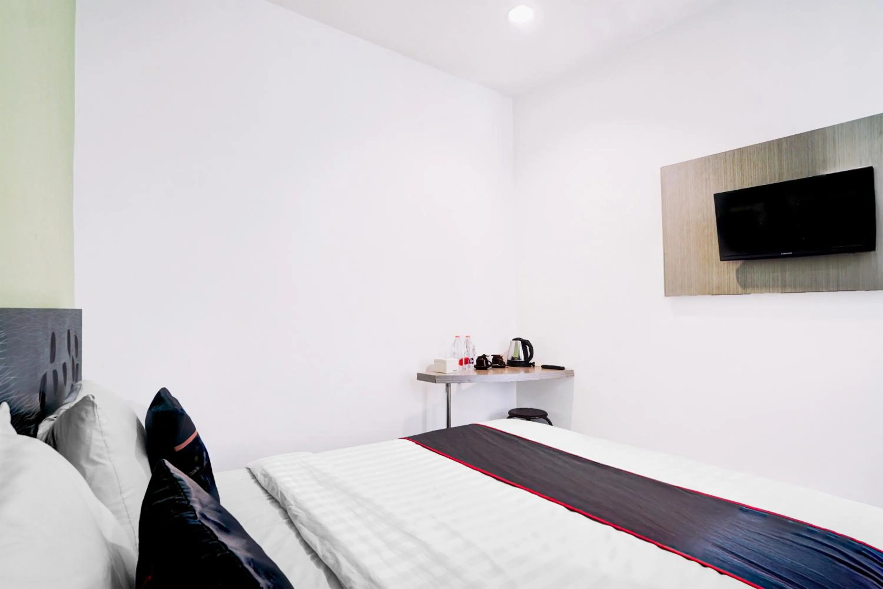 Bed in Hotel O Symphony Homestay Tlogomas