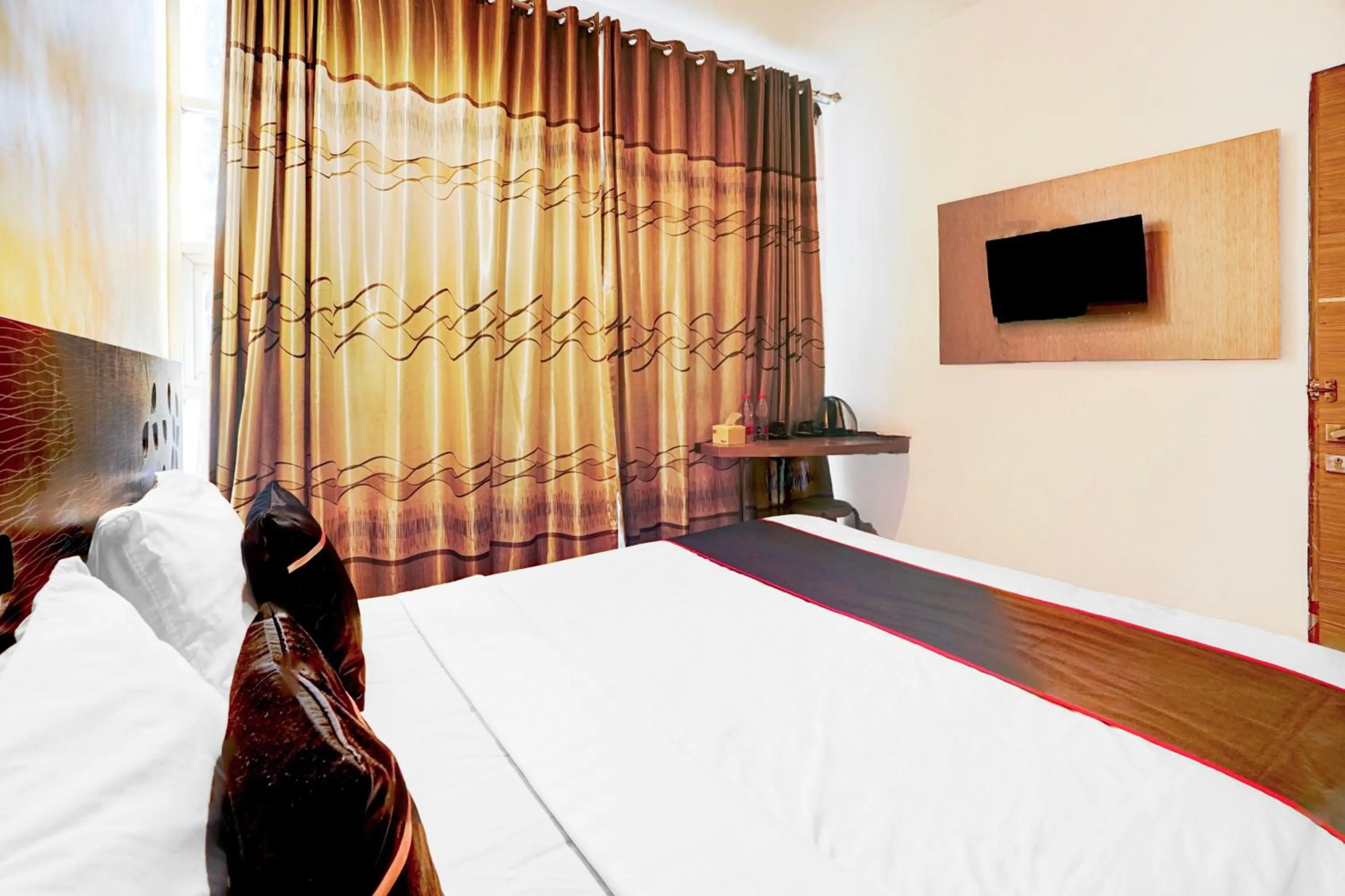 Bed in Hotel O Symphony Homestay Tlogomas