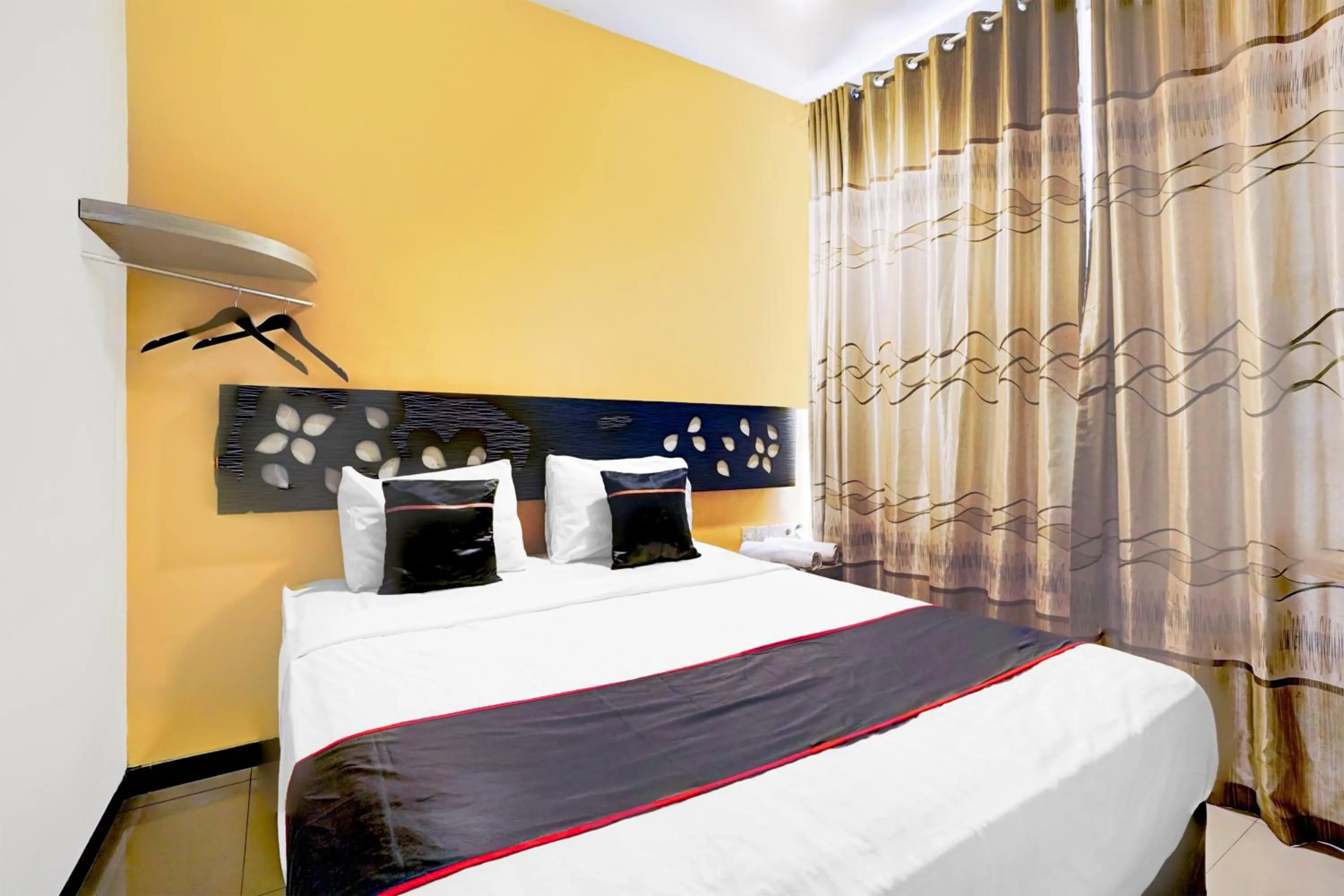 Bed in Hotel O Symphony Homestay Tlogomas