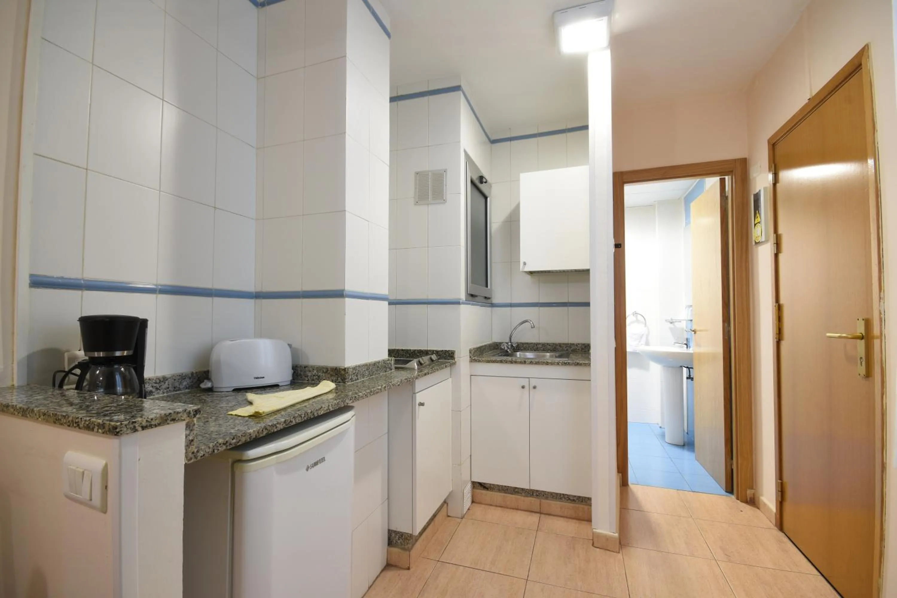 Kitchen or kitchenette in Apartamentos Tinoca