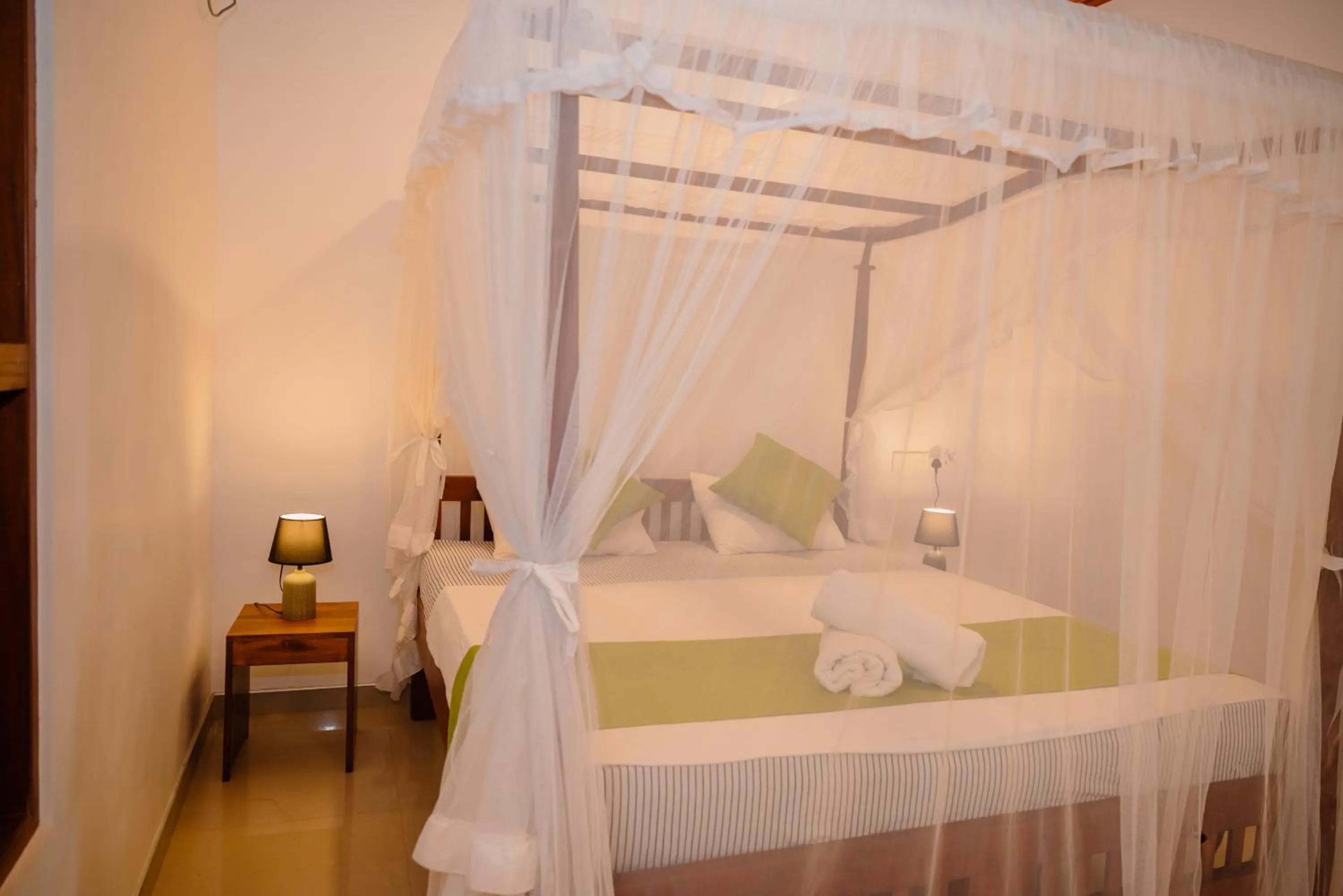 Bed in Shehani Beach Bungalow