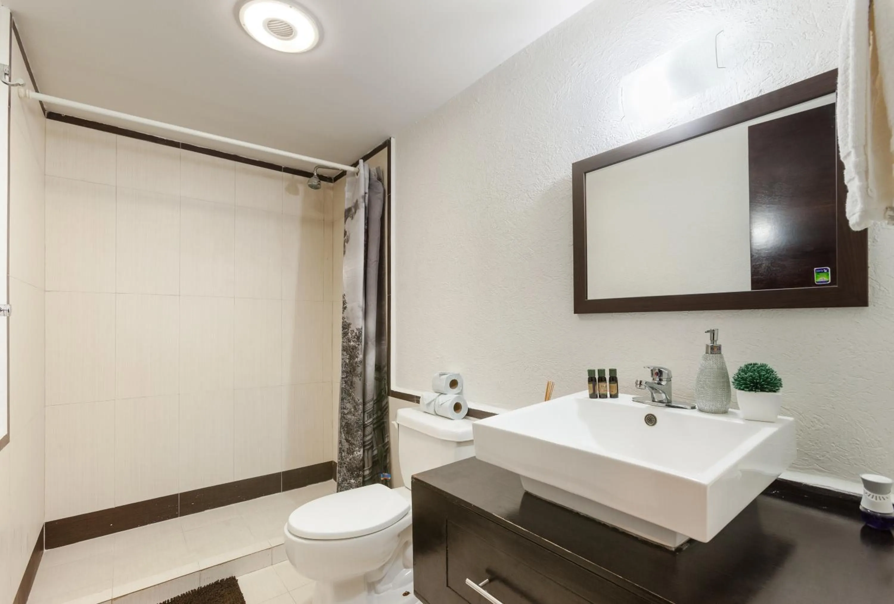 Shower in Via Tendenza Condos