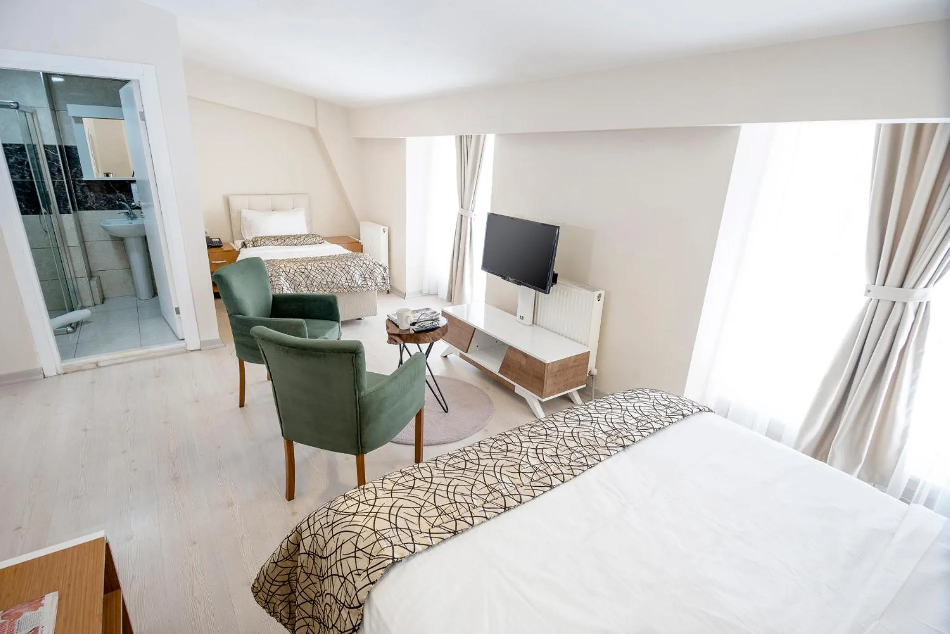 Bed in The Corner Inn Hotels By Suit