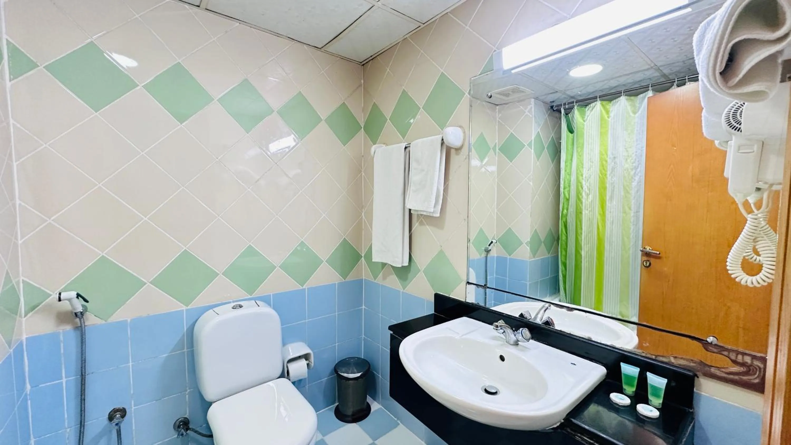 Bathroom in Collection O San Marino Hotel